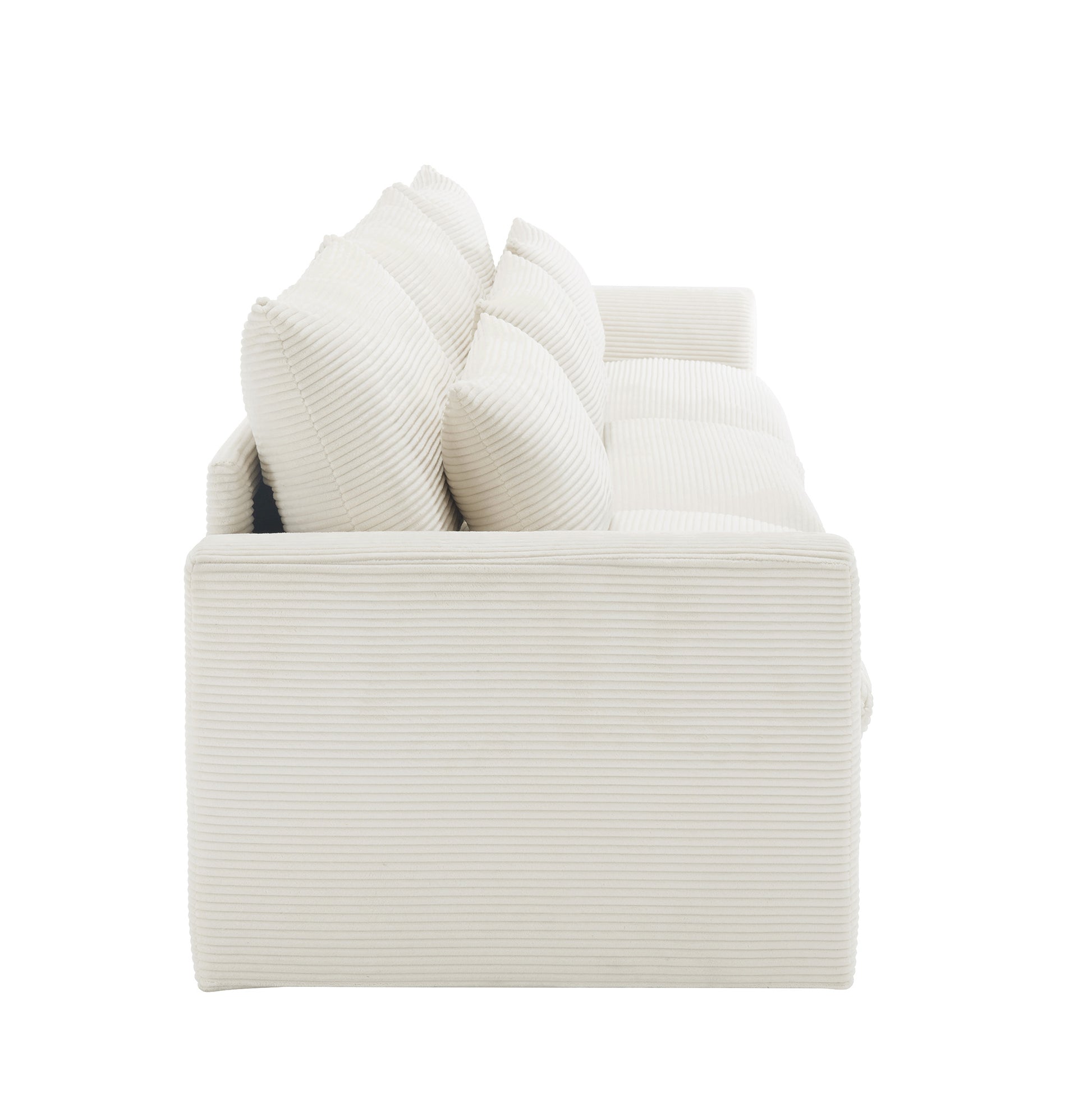 Cream corduroy sofa with plush throw pillows ideal for a cozy living room