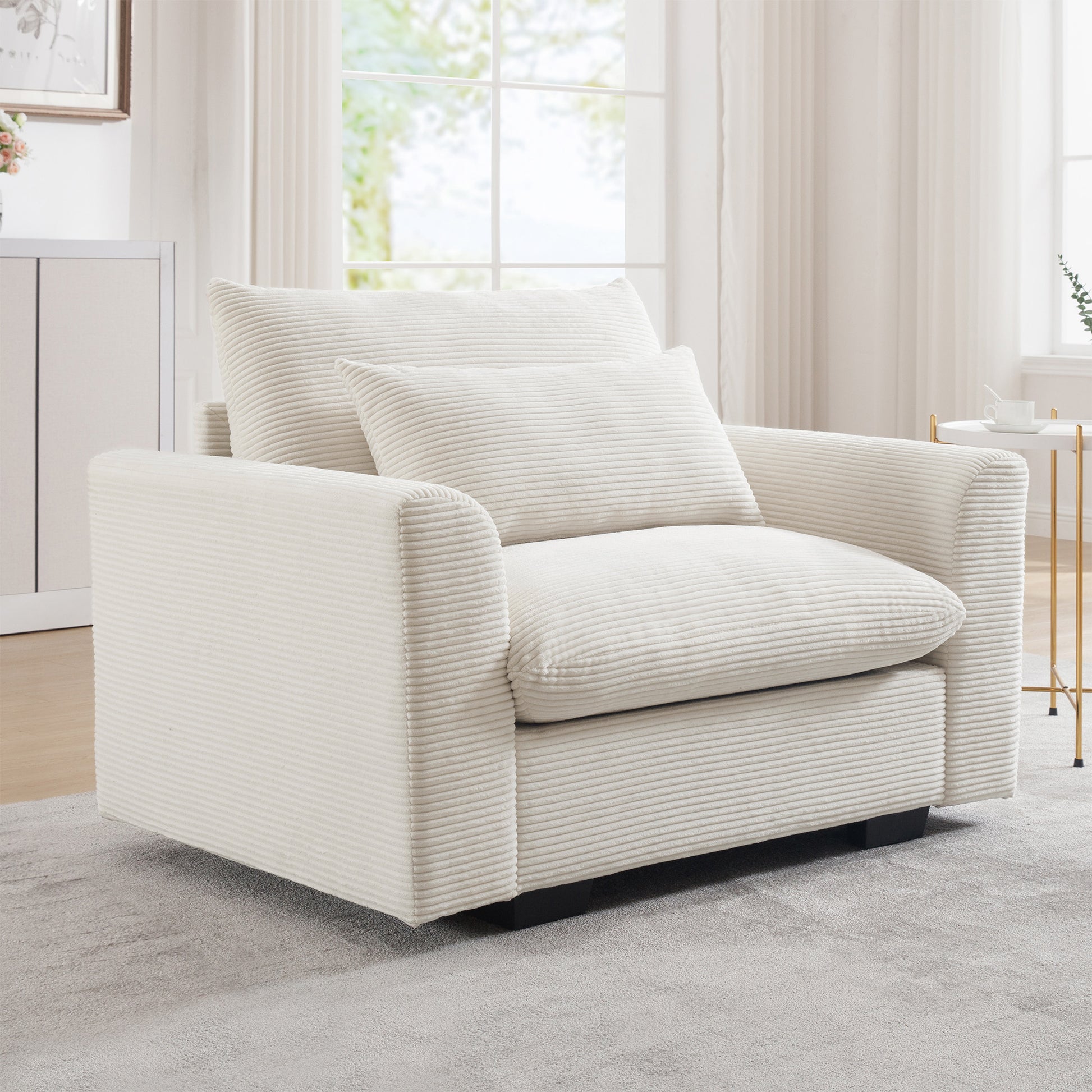 Cream corduroy accent chair with plush cushions and wide arms for comfort