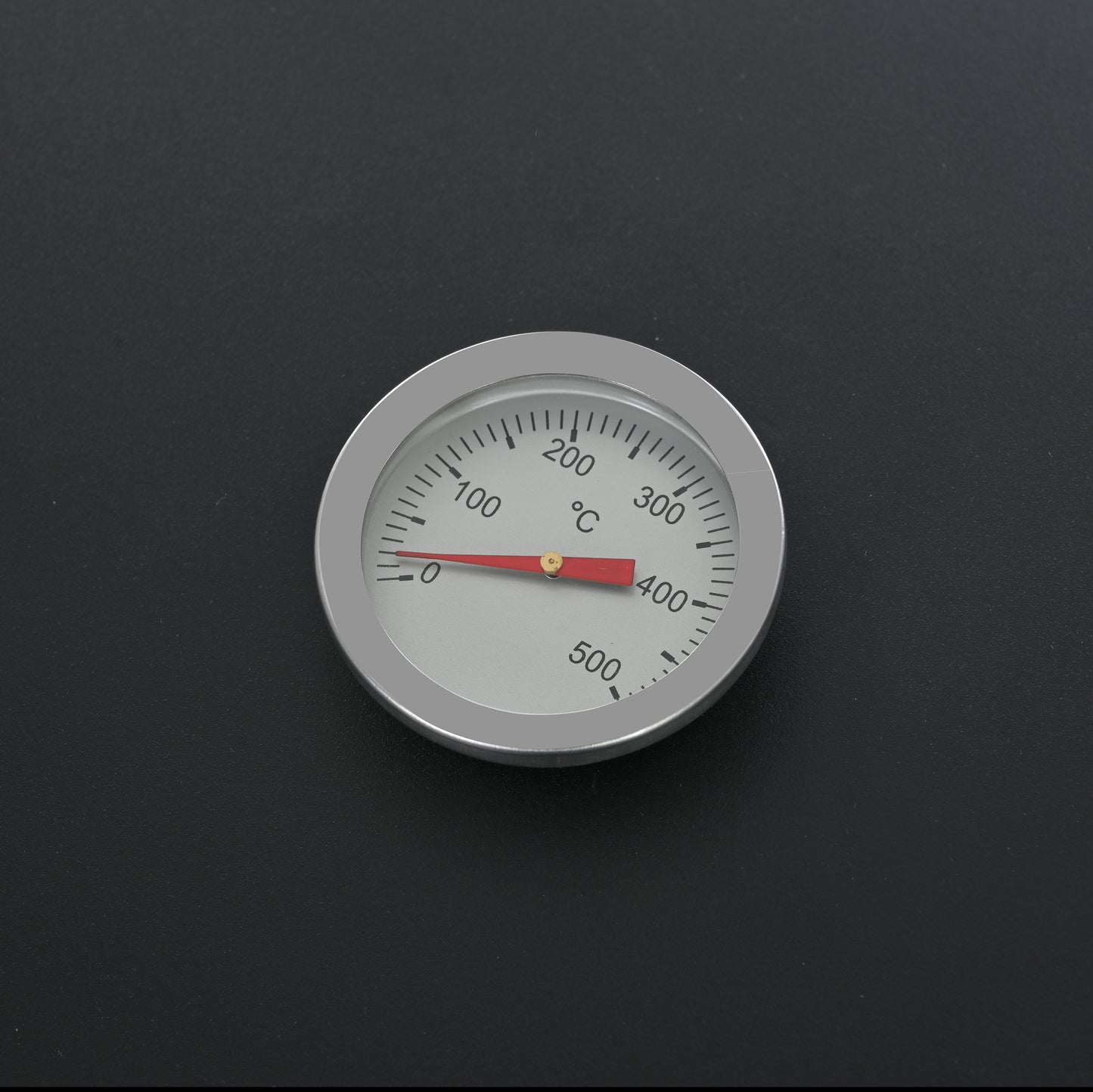 Round stainless steel BBQ thermometer dial reads  to  degrees Celsius