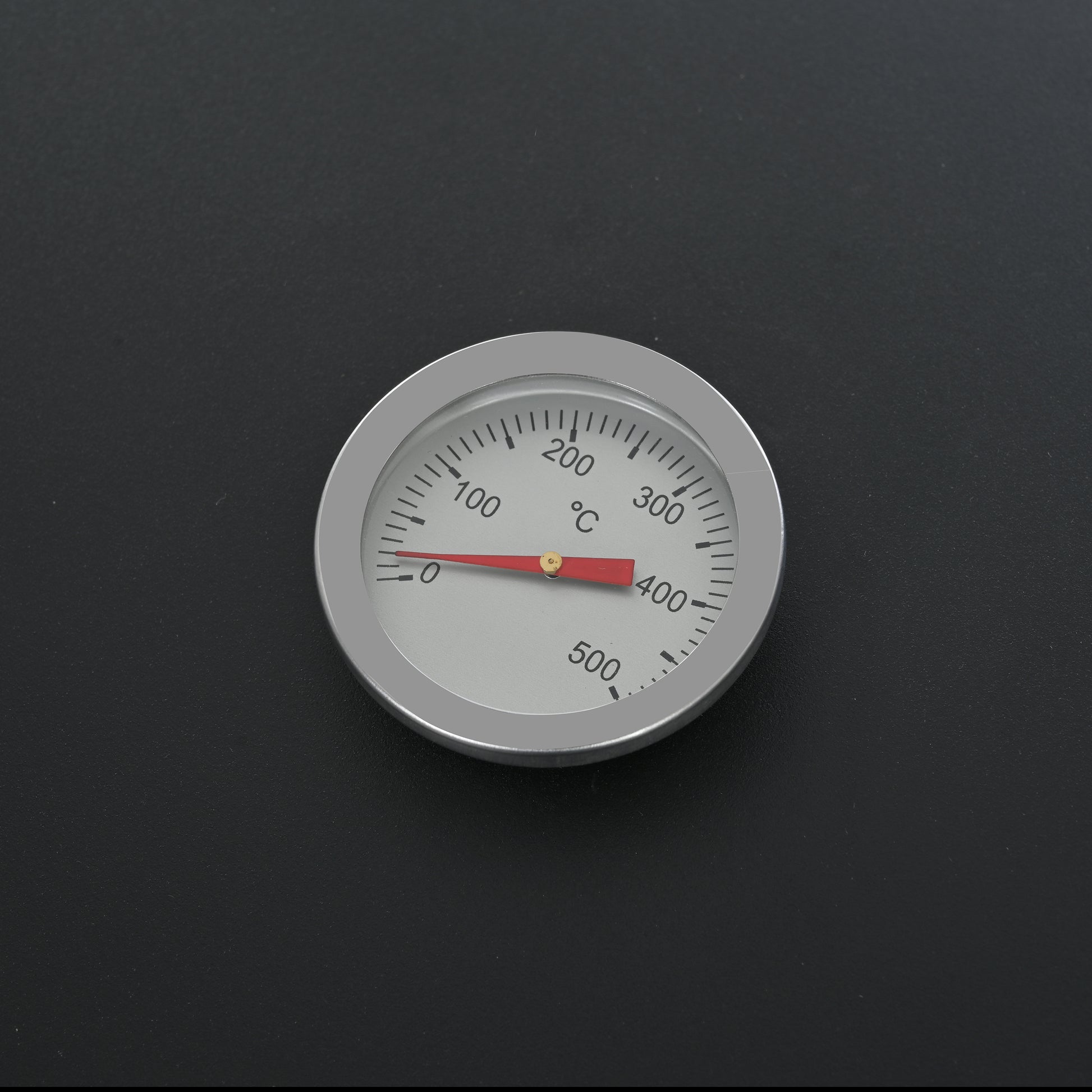 Round stainless steel BBQ thermometer dial reads  to  degrees Celsius
