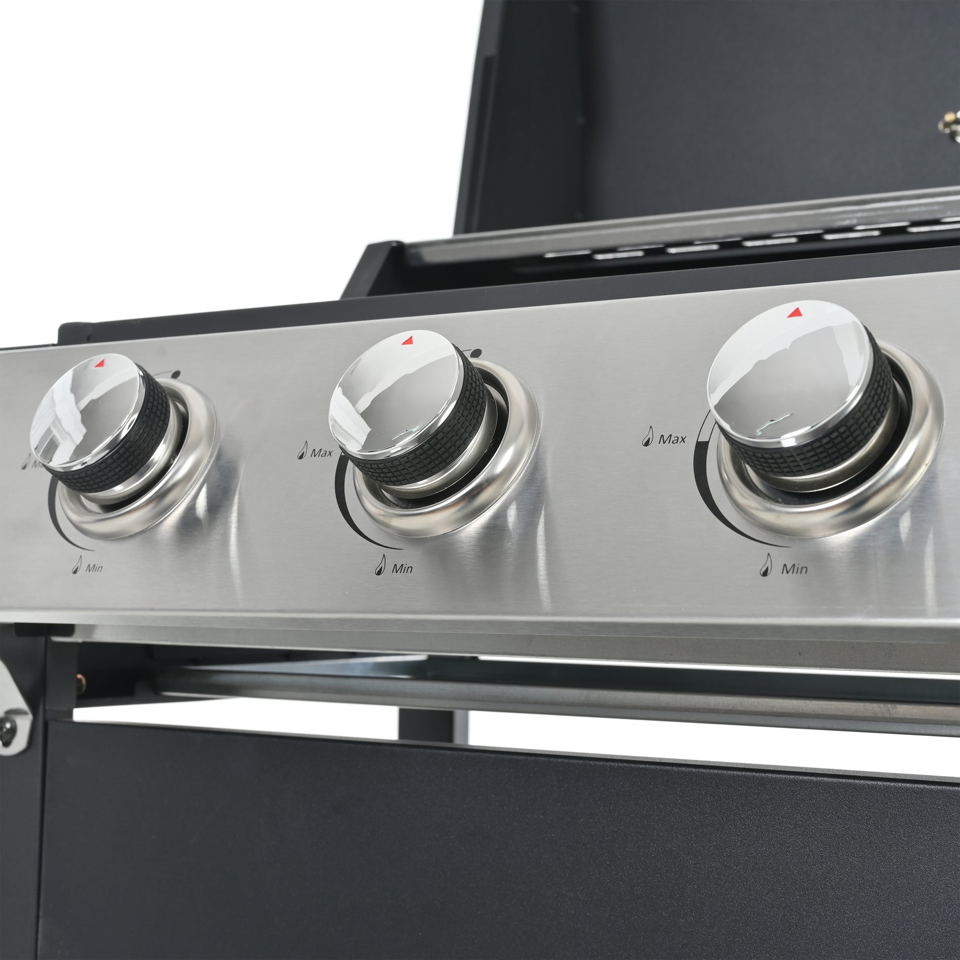 Closeup of three chrome knobs on a stainless steel gas grill control panel showing minmax settings