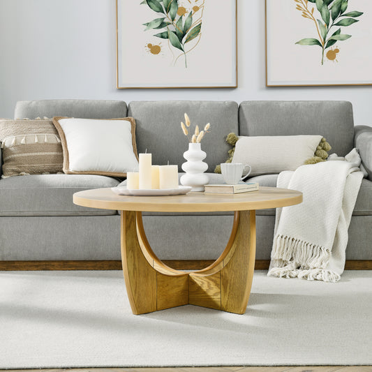 Round oak coffee table with curved wooden legs perfect for living rooms