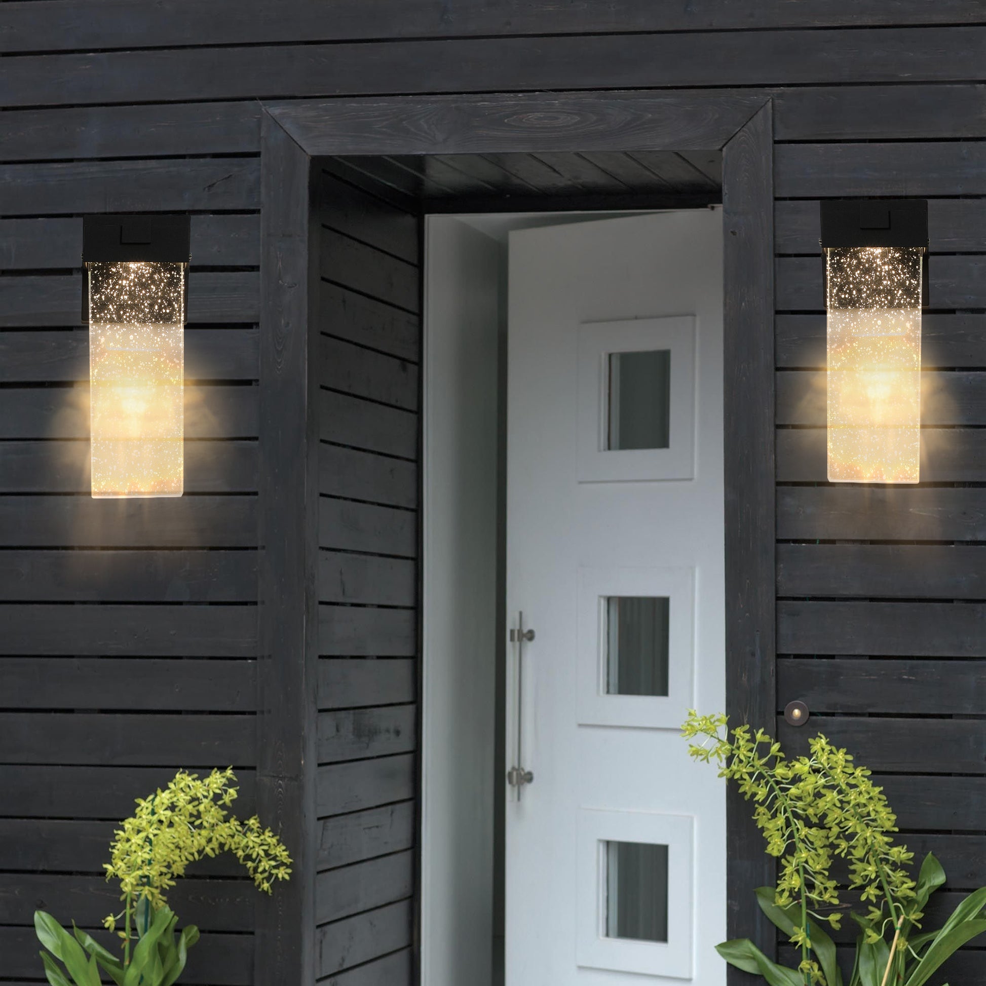 Modern rectangular outdoor wall light with a speckled glass shade and warm LED illumination