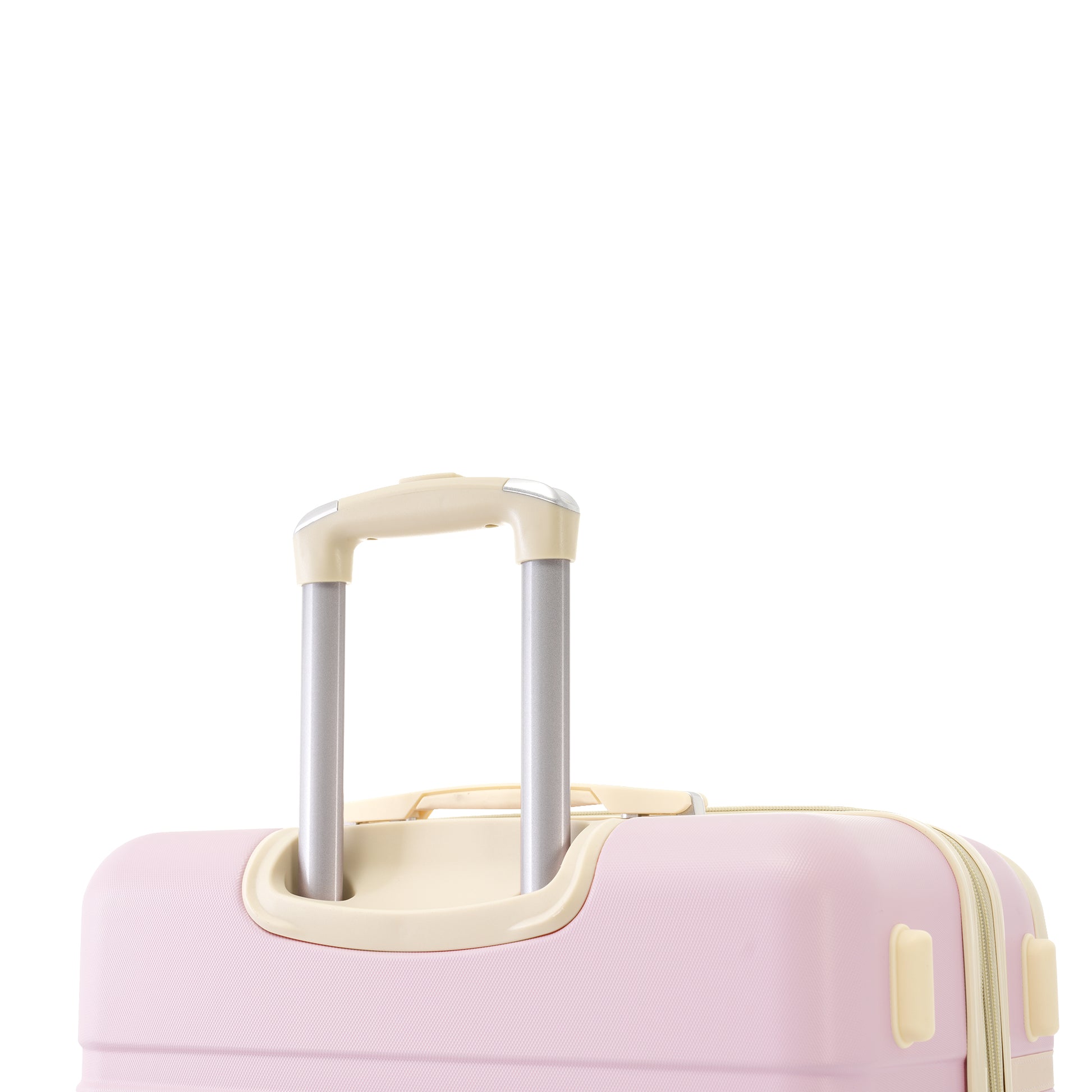 Closeup of a pink hardside suitcase with a retractable silver handle and cream accents