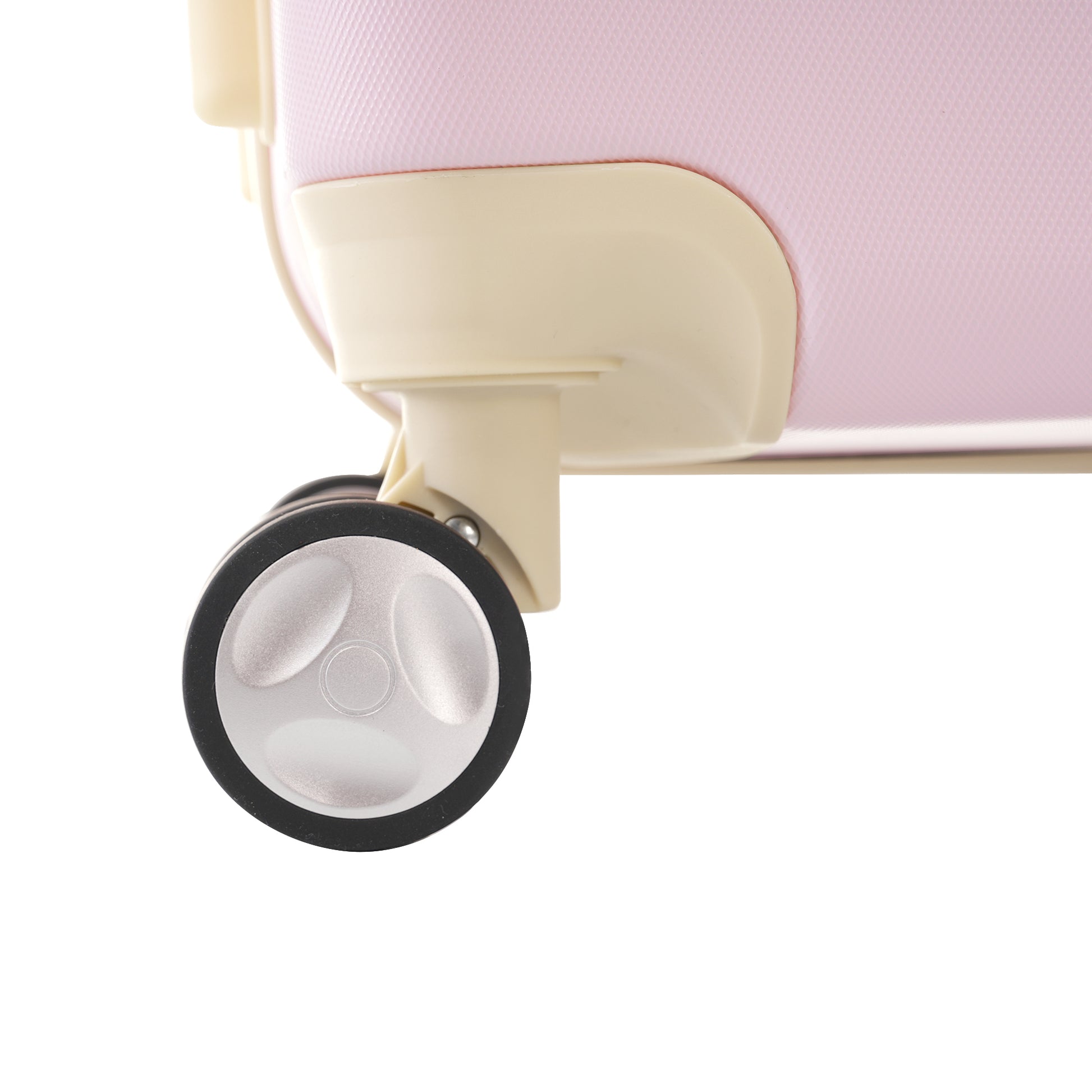 Closeup of pink textured suitcase with a silver and black spinner wheel