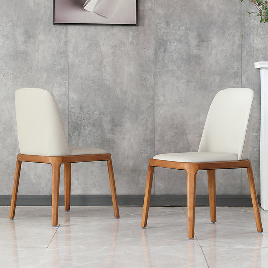Modern dining chair with cream vegan leather upholstery and solid wood frame
