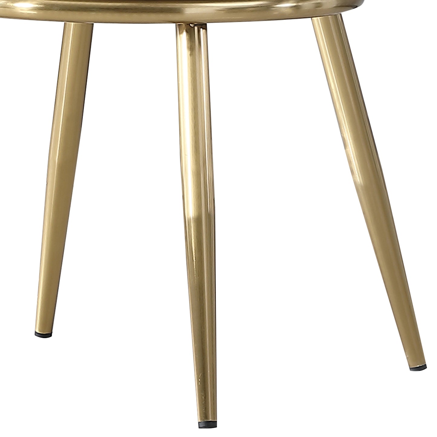 Close up of gold metal table legs with tapered design