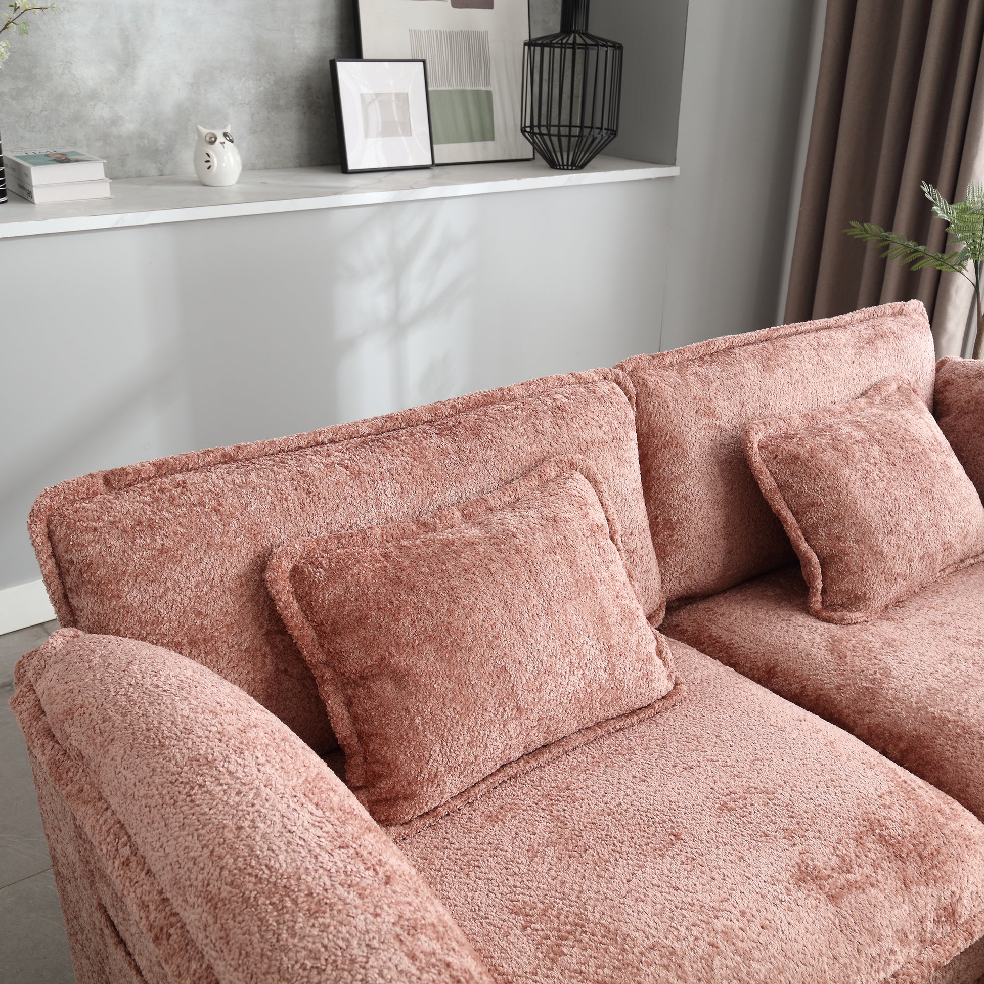 Plush rose sectional sofa with textured fabric and comfortable cushions perfect for modern living rooms