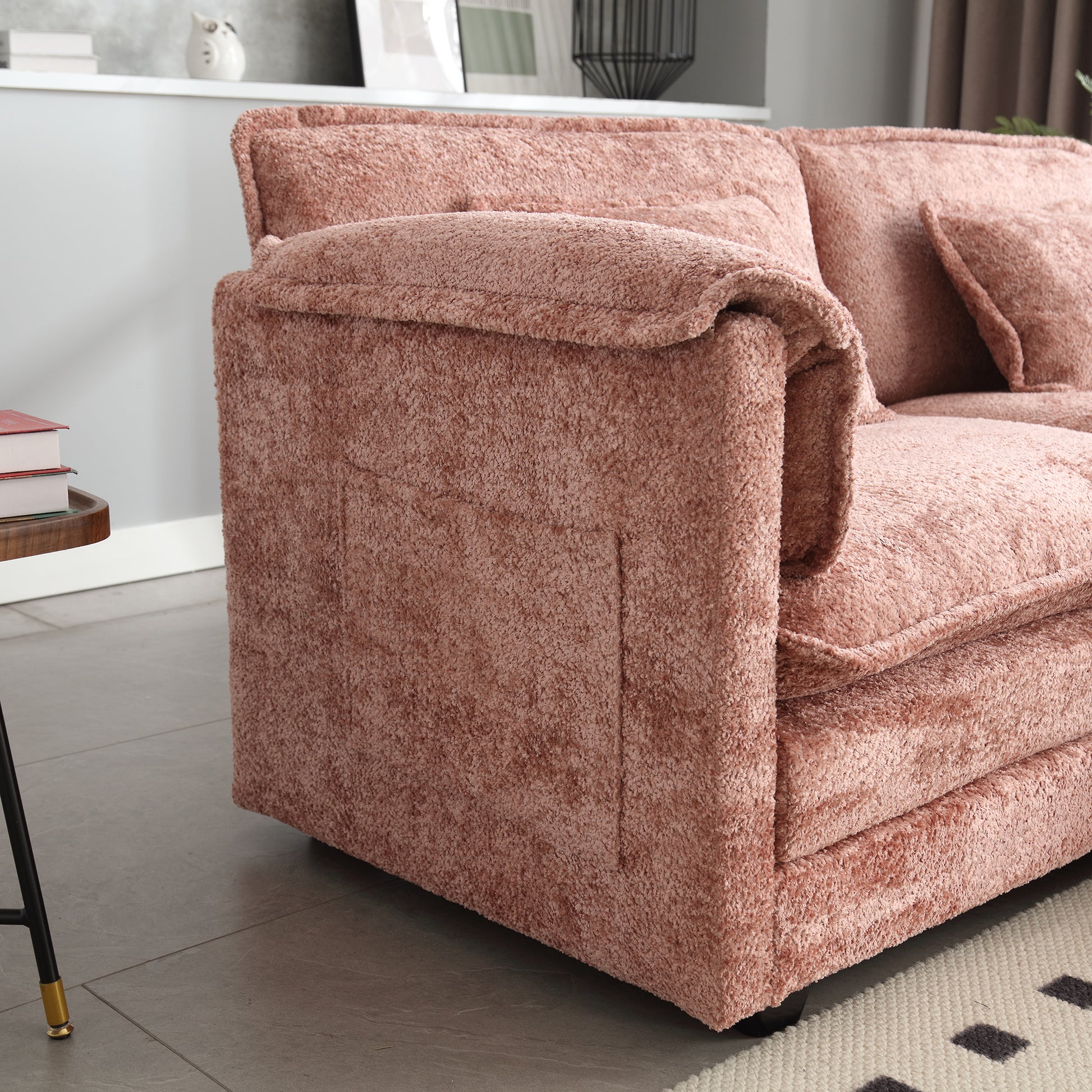Plush rose gold sofa with deepseated cushions and textured fabric