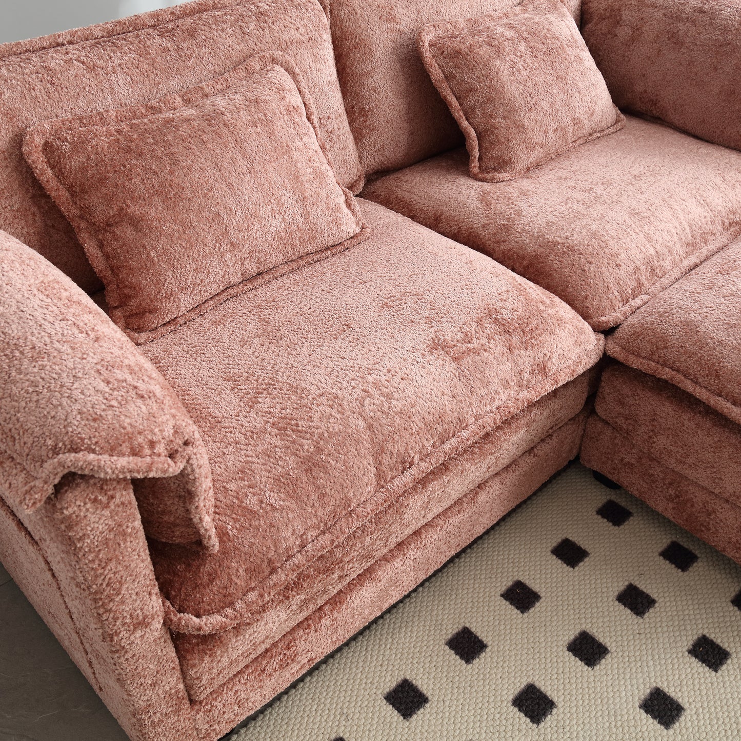 Plush rose pink sectional sofa with deep comfortable cushions perfect for living rooms