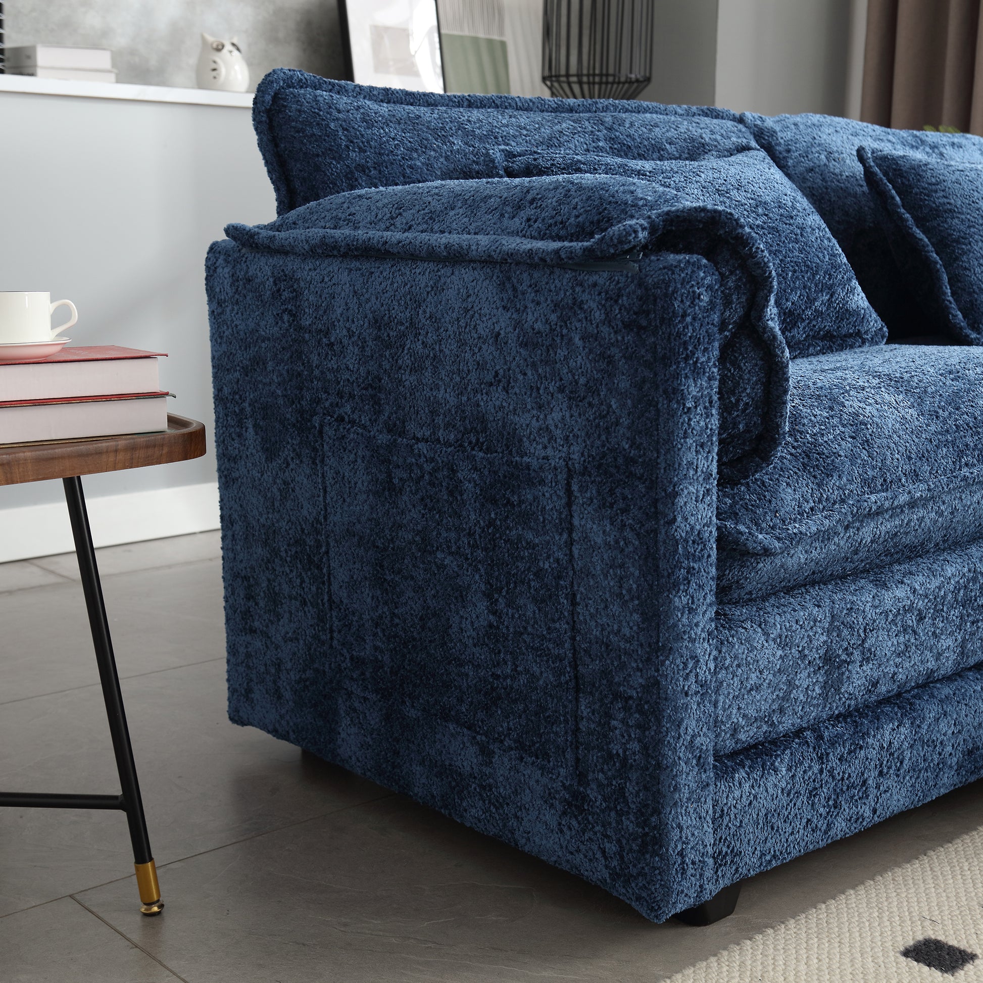 Deep navy blue boucl fabric sectional sofa with plush cushions for comfortable living room seating