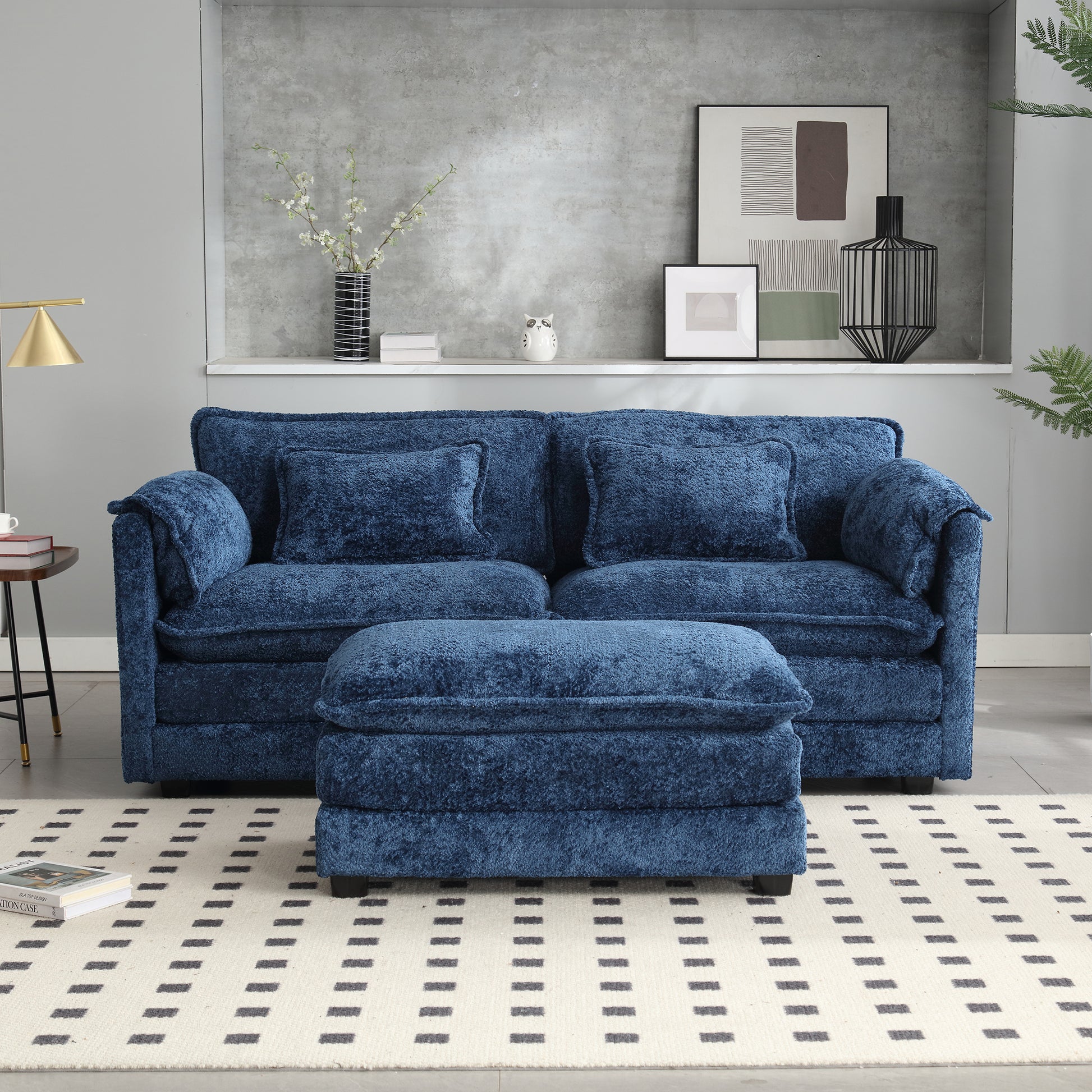Plush navy blue sofa with matching ottoman perfect for a modern living room