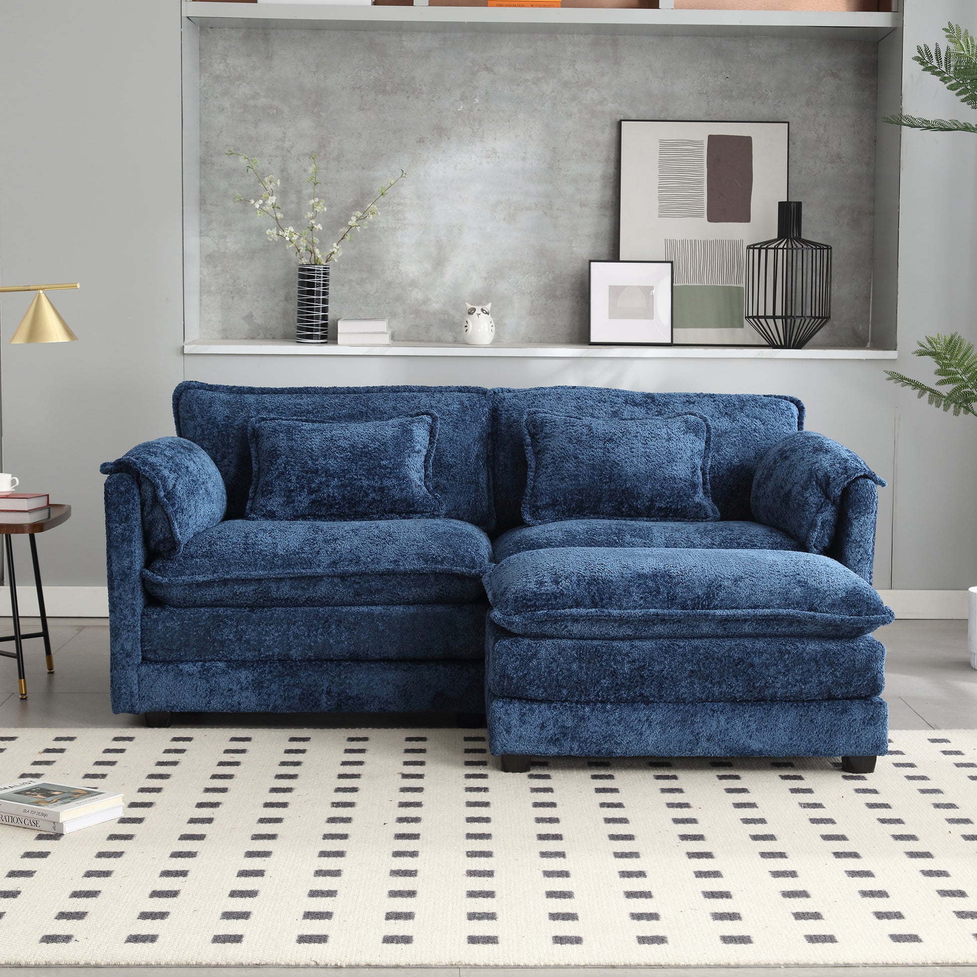 Plush navy blue sectional sofa with textured fabric and throw pillows