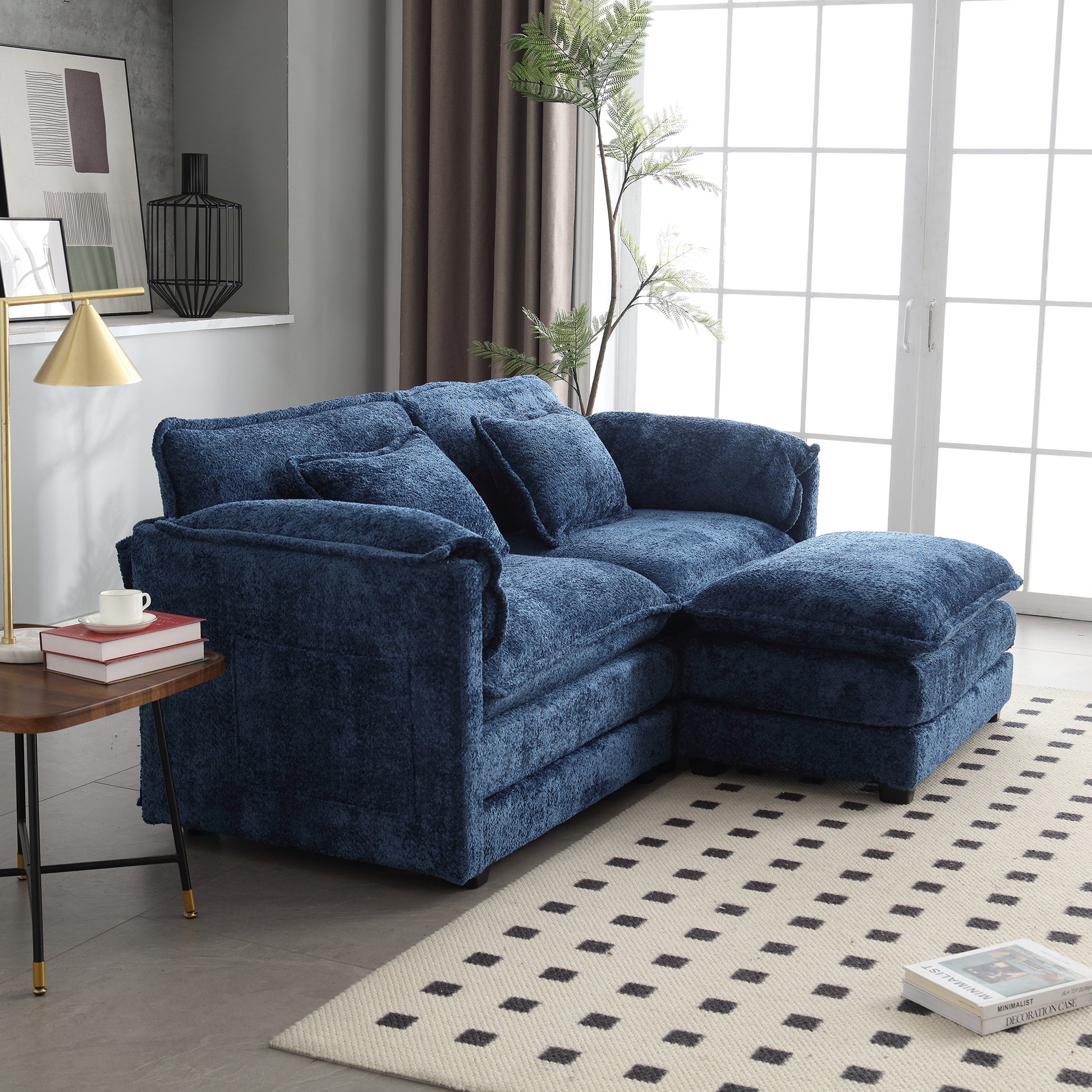 Deep blue textured sectional sofa with plush cushions and ottoman