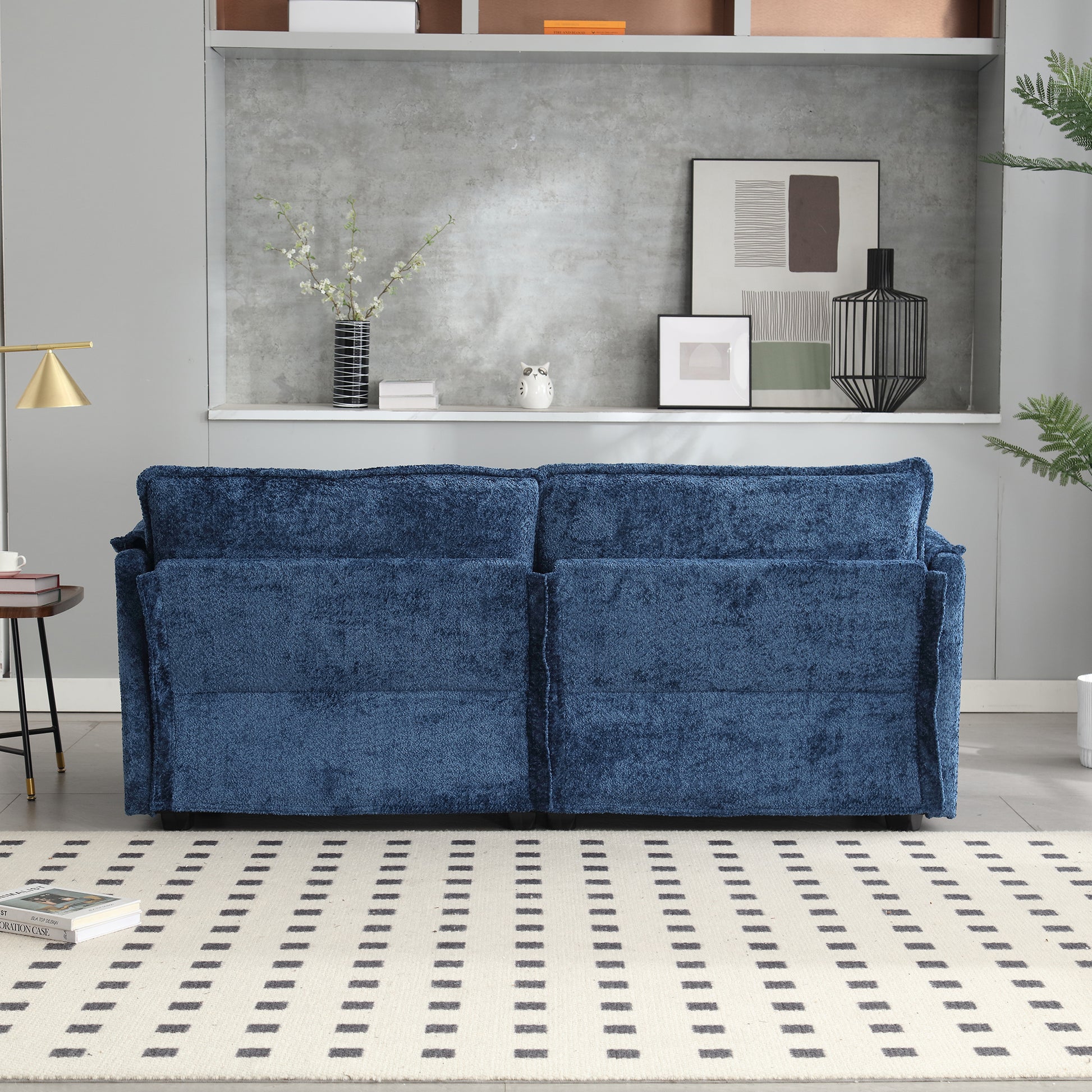Deep blue textured fabric sofa with plush cushions perfect for a modern living room