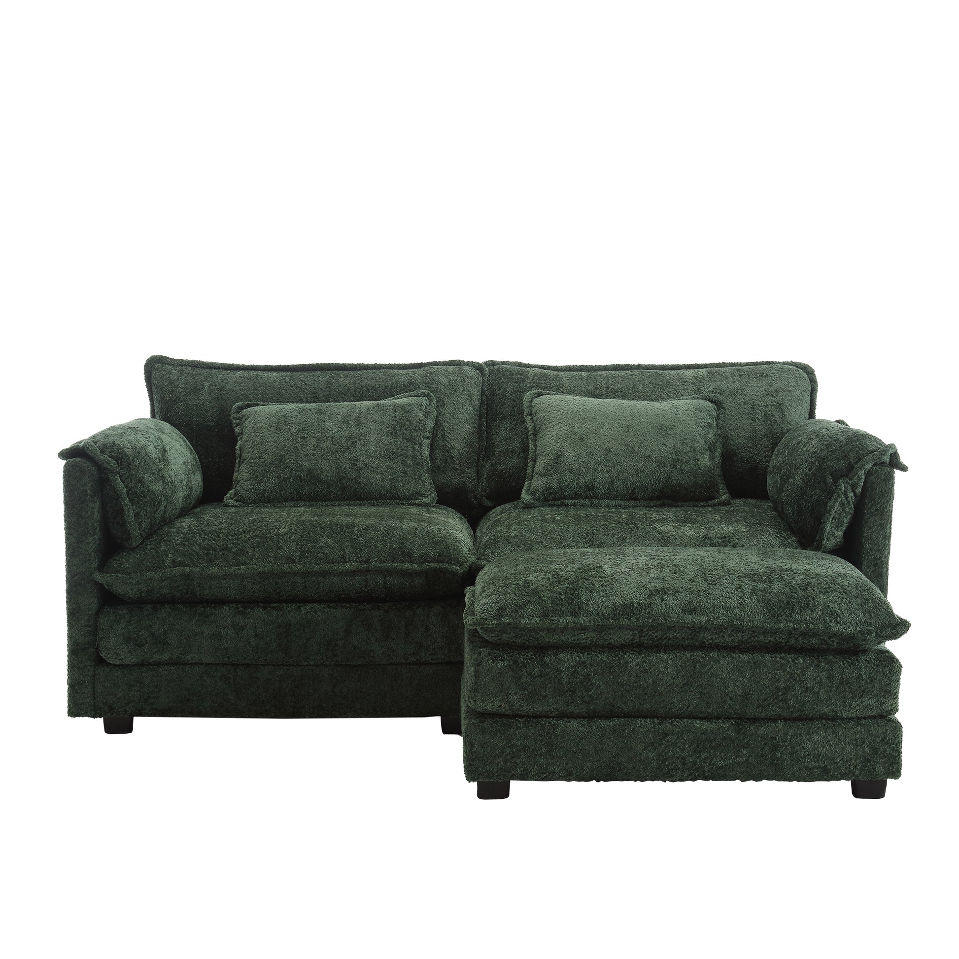 Plush emerald green sectional sofa with textured fabric and matching throw pillows