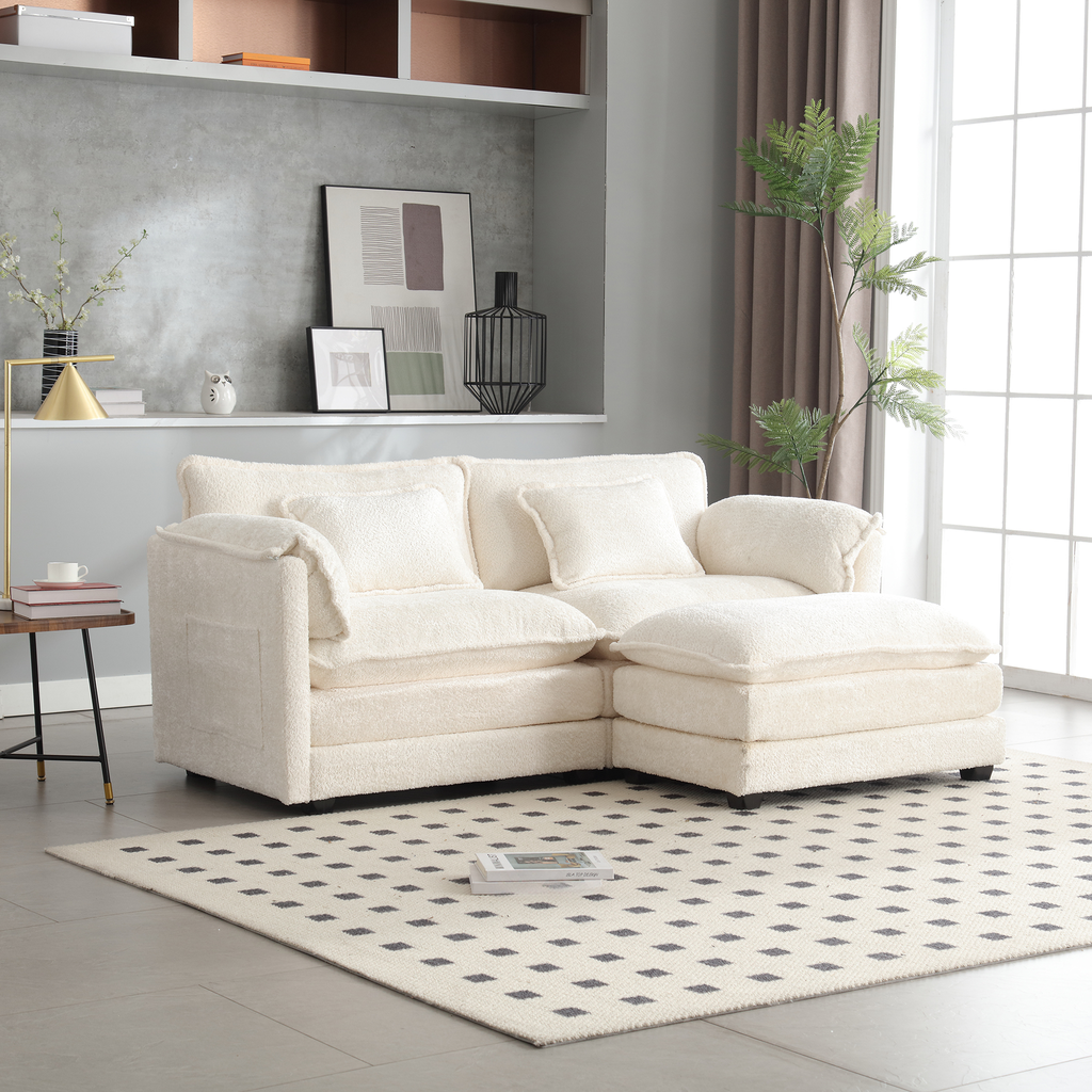 Cream teddy fabric sectional sofa with plush cushions and an ottoman