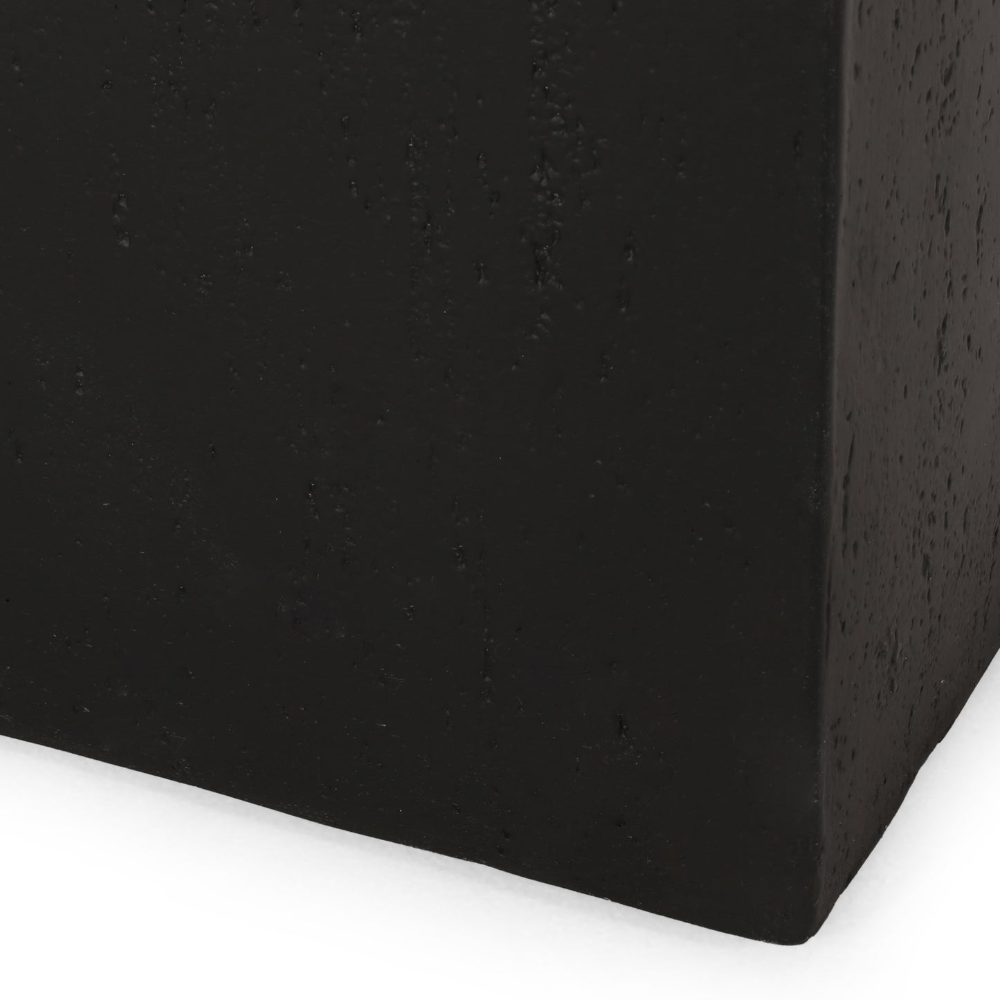 Black textured concrete planter with a minimalist design