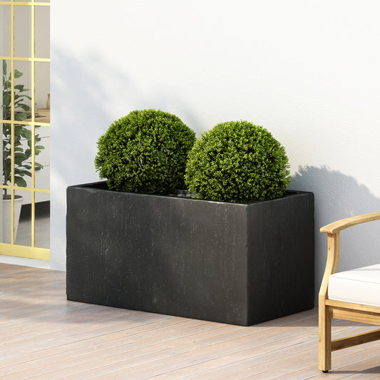 Large dark grey rectangular planter with two perfectly round green topiaries on wooden deck