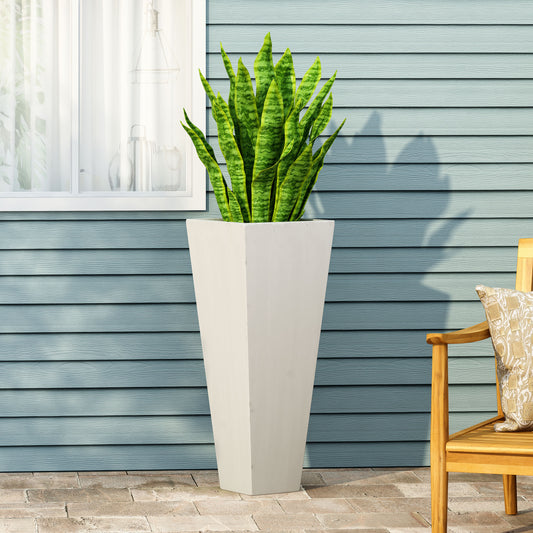 Tall geometric planter with a snake plant perfect for modern patio decor