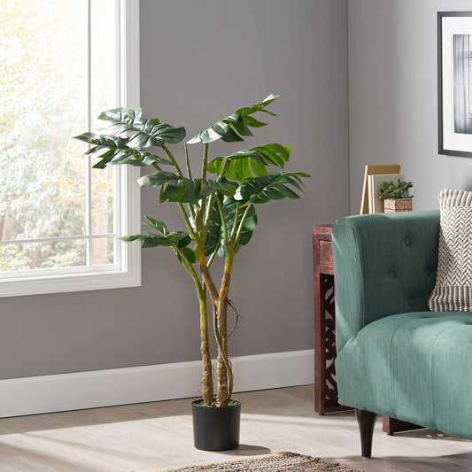 Tall artificial Monstera plant with lush green leaves in a black pot ideal for home decor