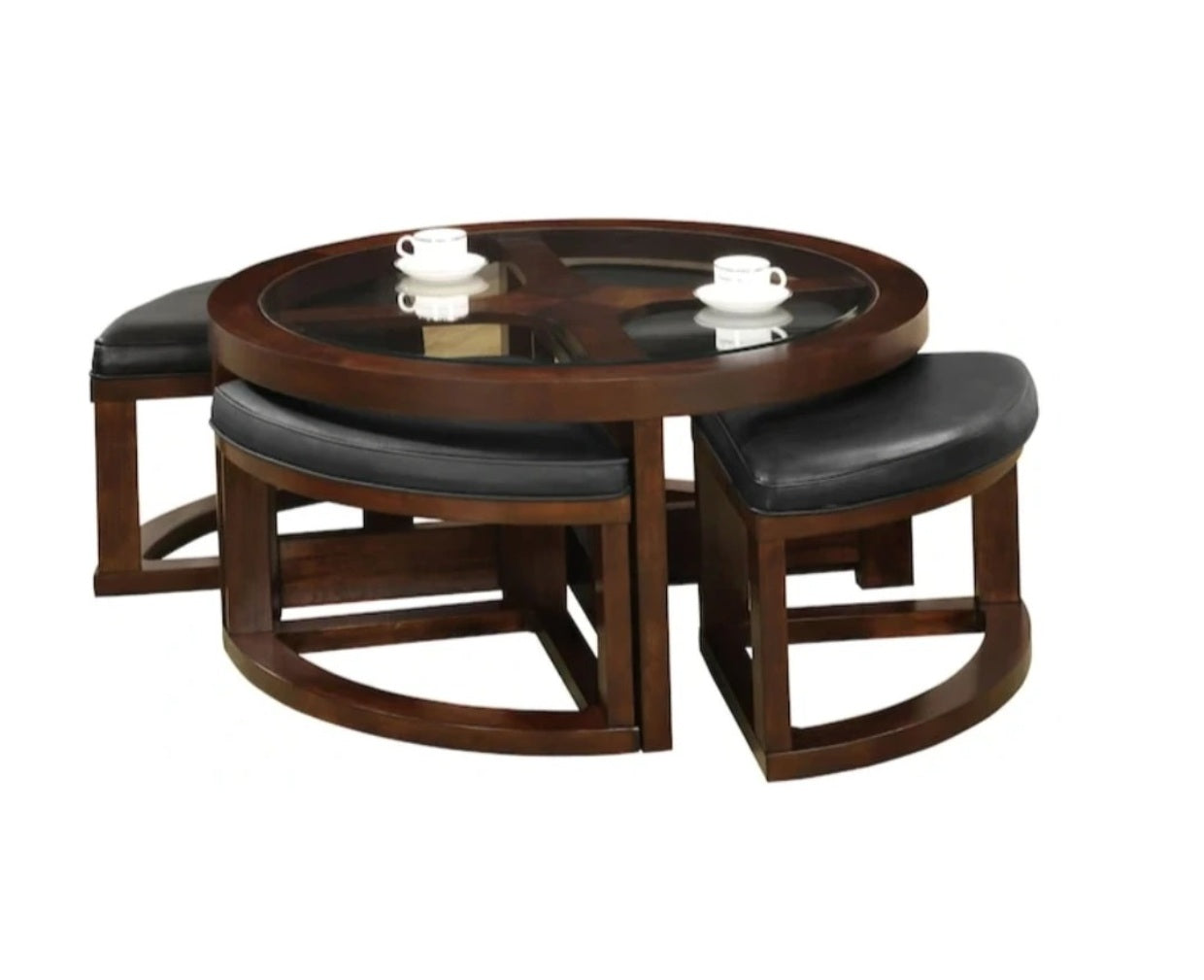 Round coffee table with glass top and four black leather stools for living rooms