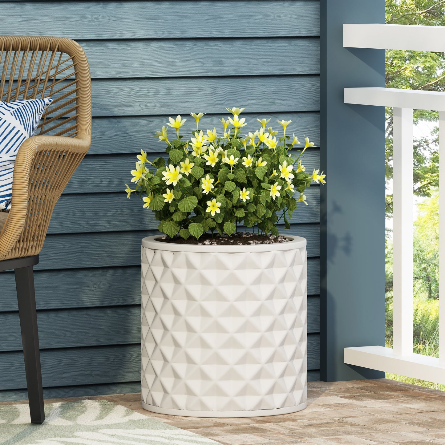White geometric planter with yellow flowers ideal for patio decor