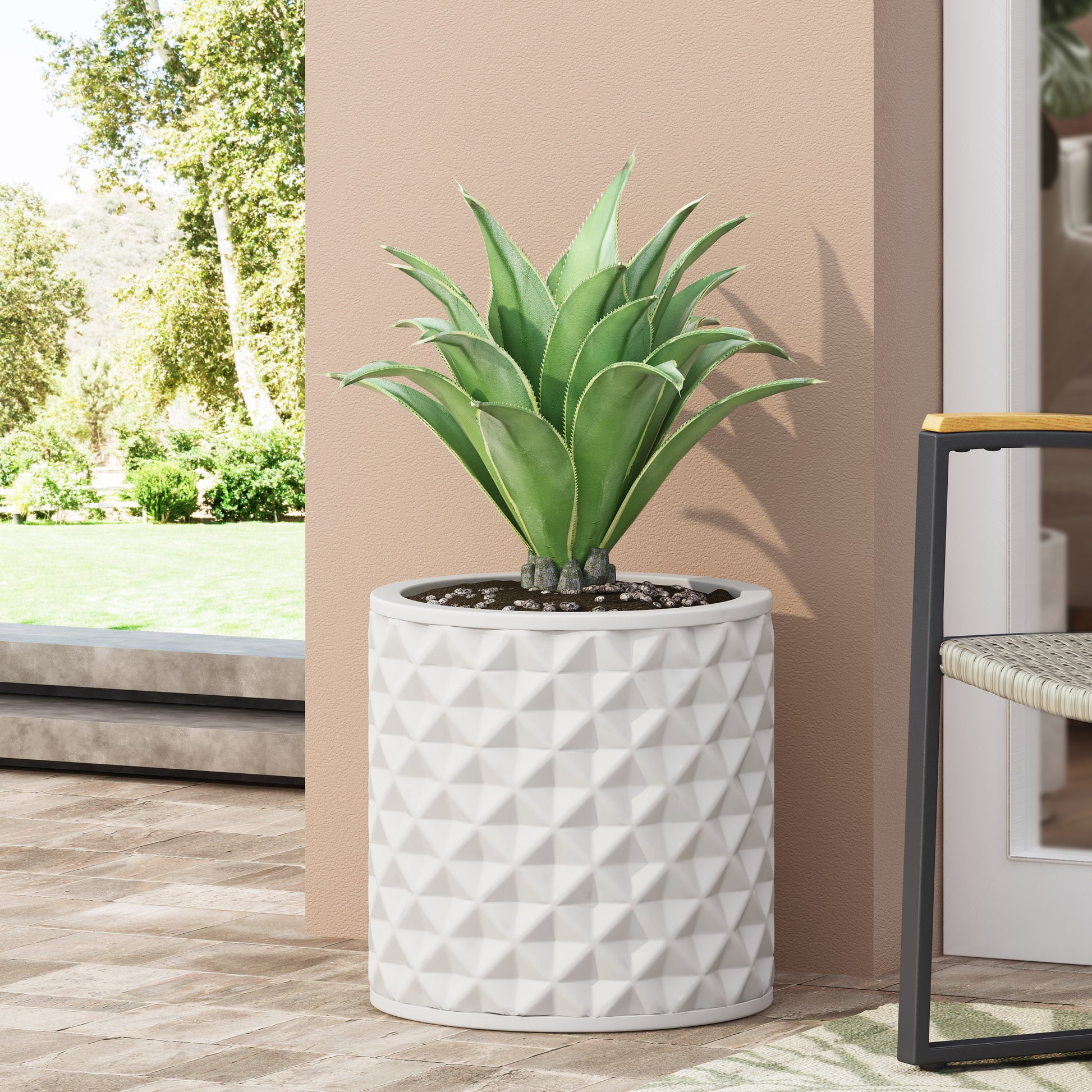 White diamondpatterned ceramic planter with a large green succulent plant for outdoor decor