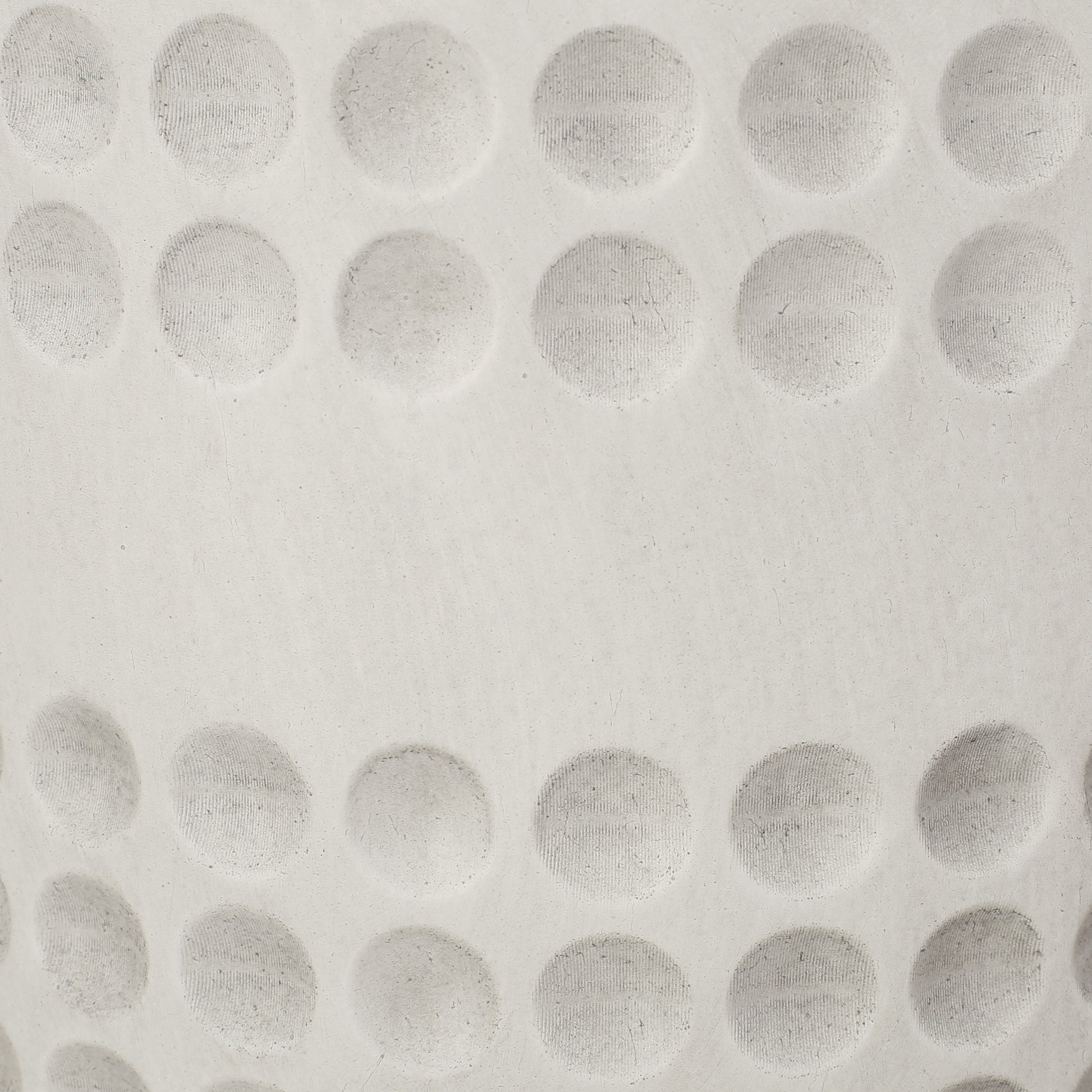 Closeup textured ceramic surface with embossed circular patterns