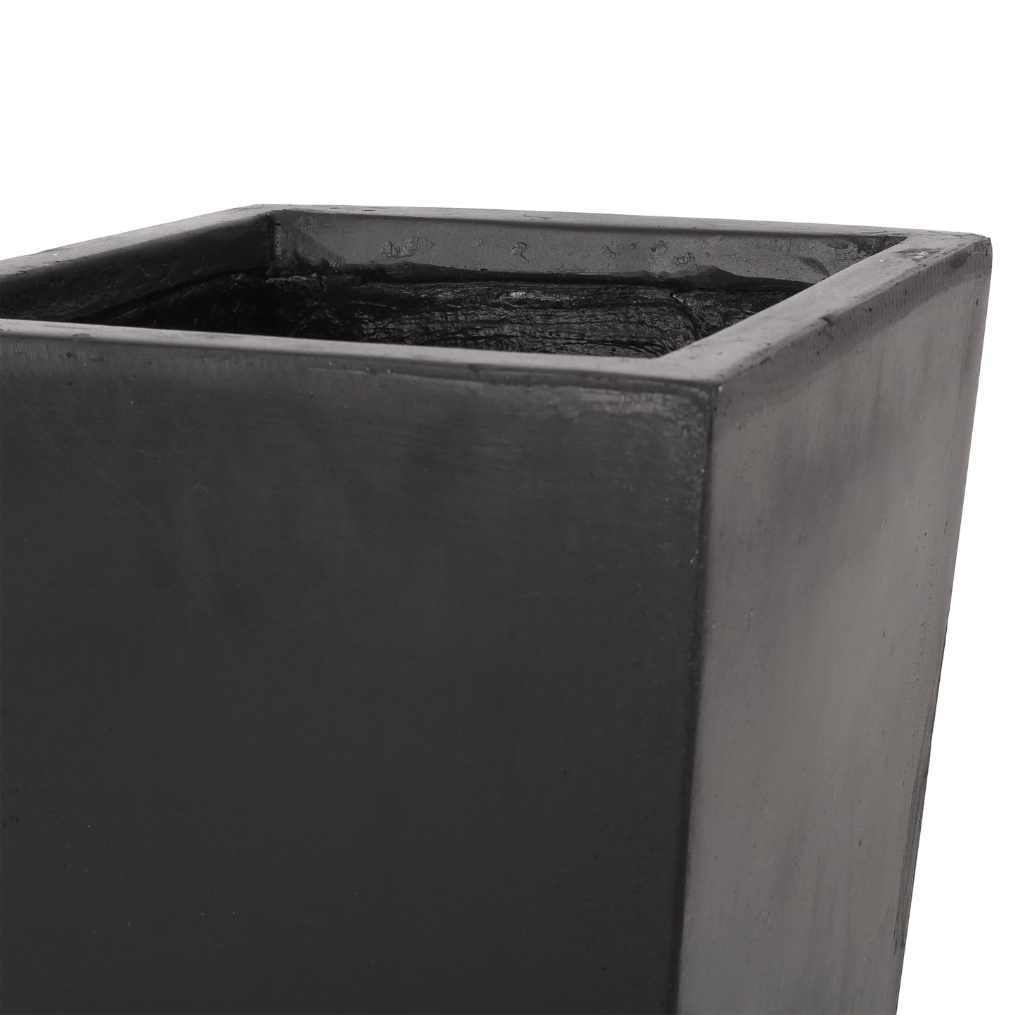 Closeup of a large square charcoal grey concrete planter with a textured interior