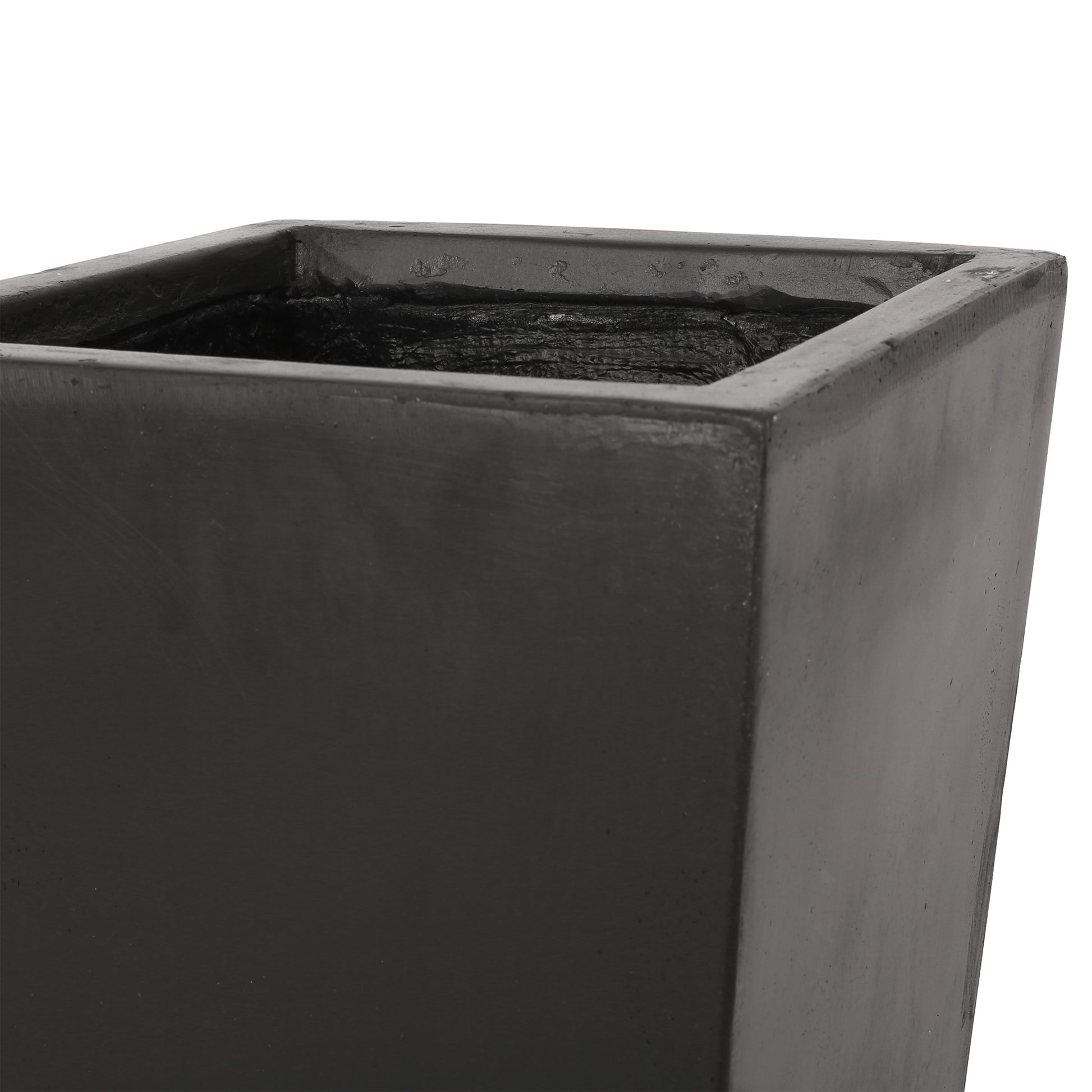 Closeup of a large square charcoal grey concrete planter with a textured interior