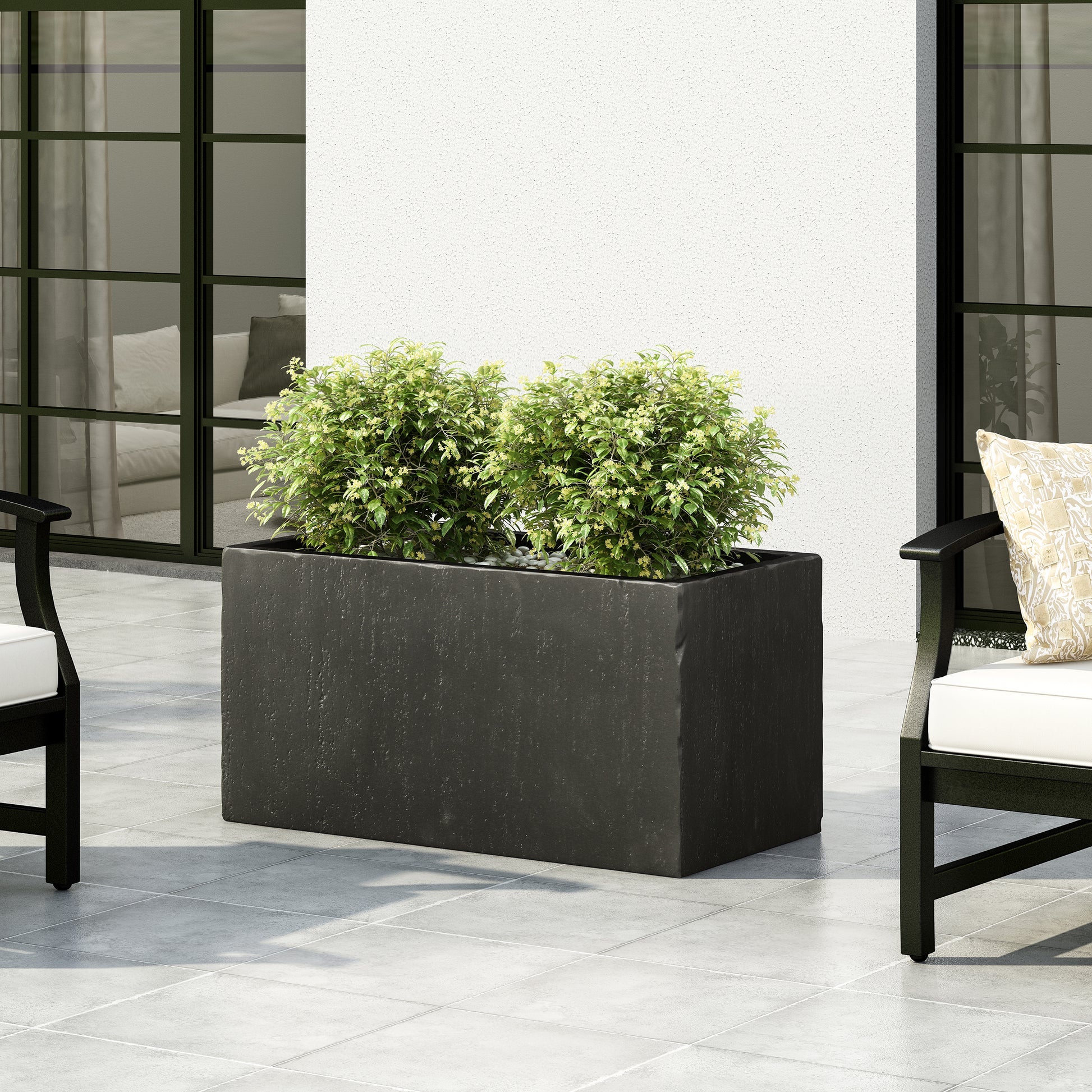 Dark gray rectangular stone planter with lush green plants