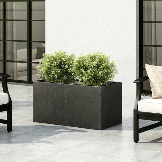 Dark gray rectangular stone planter with lush green plants