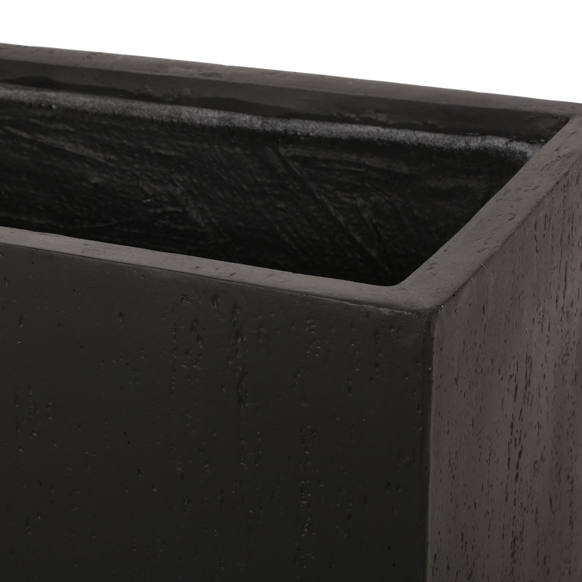 Rectangular dark grey concrete planter with textured surface detail