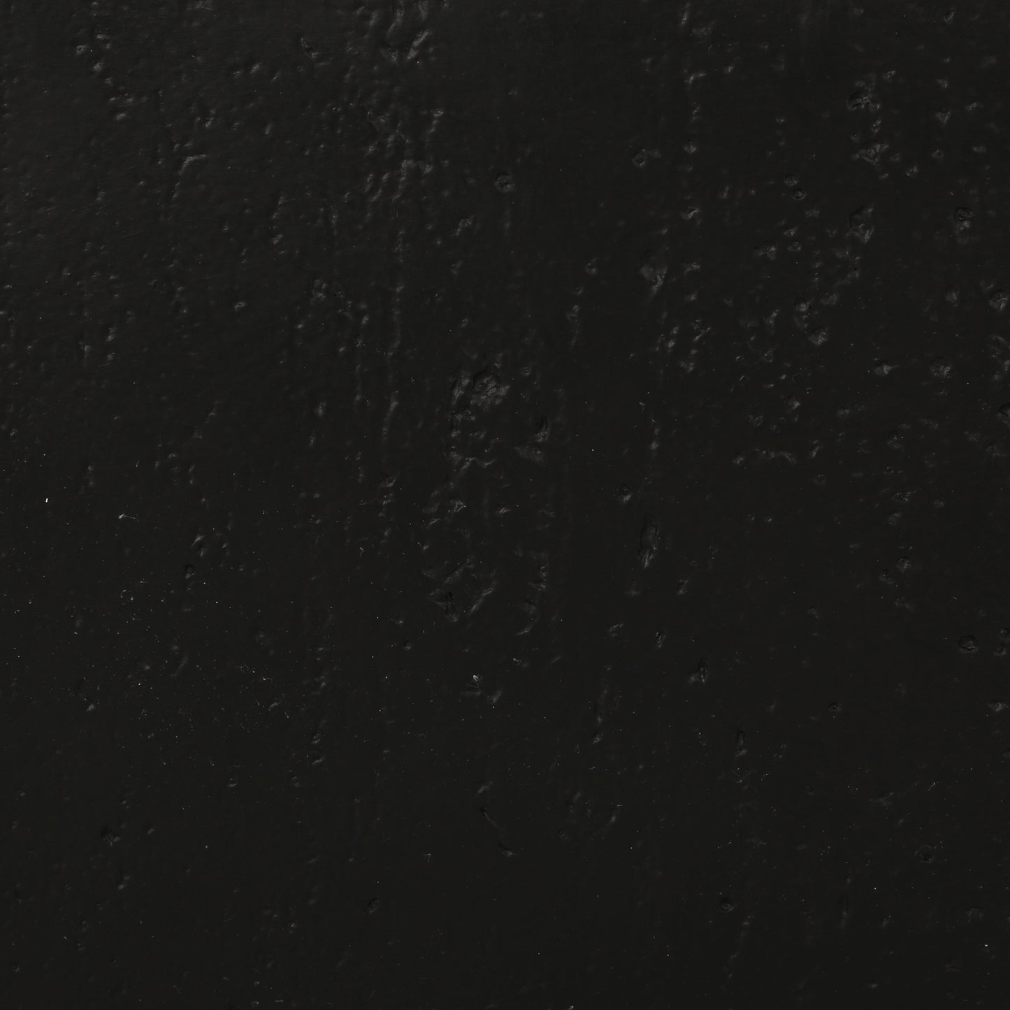 Dark grey textured background with subtle undulations perfect for a matte finish product display