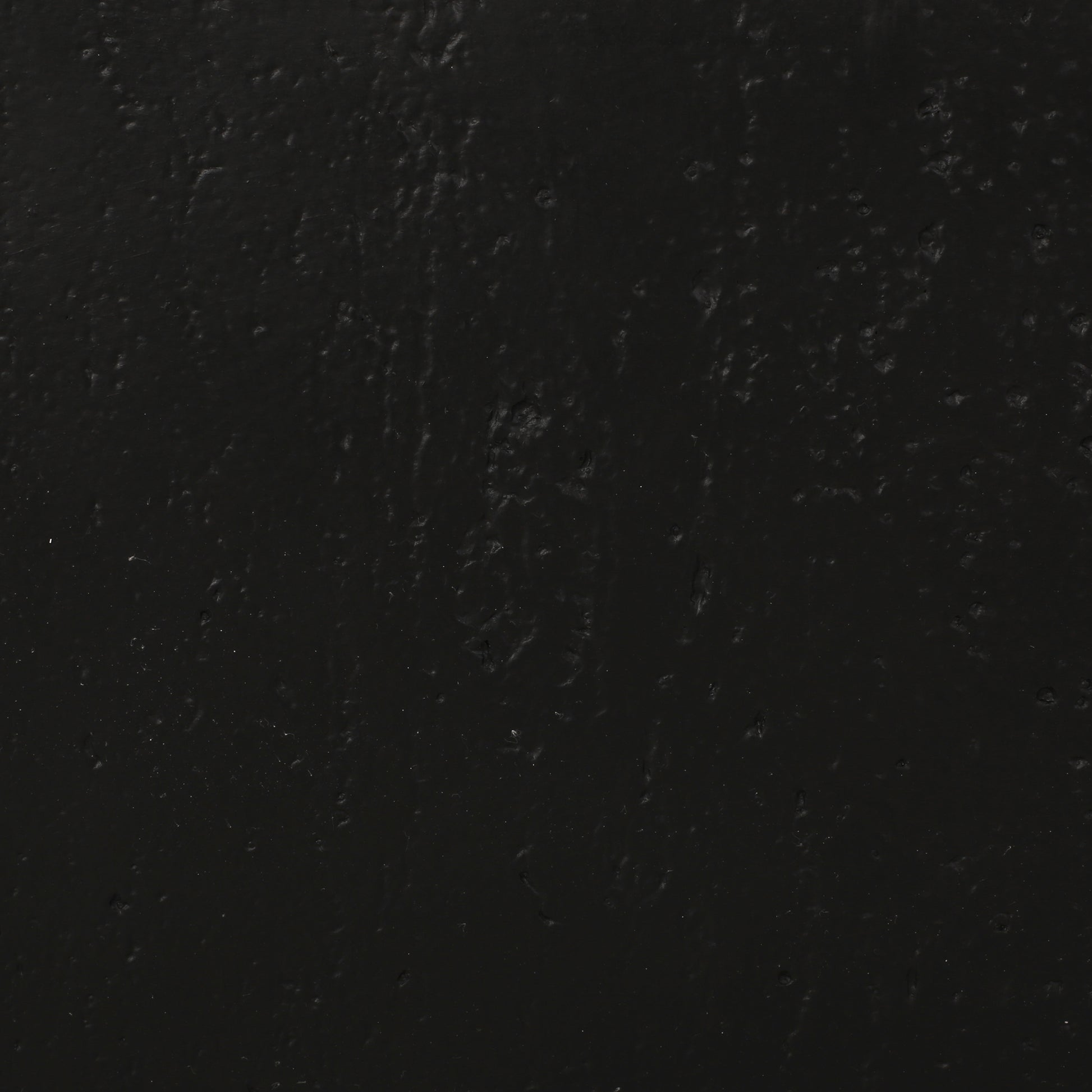 Dark grey textured background with subtle undulations perfect for a matte finish product display