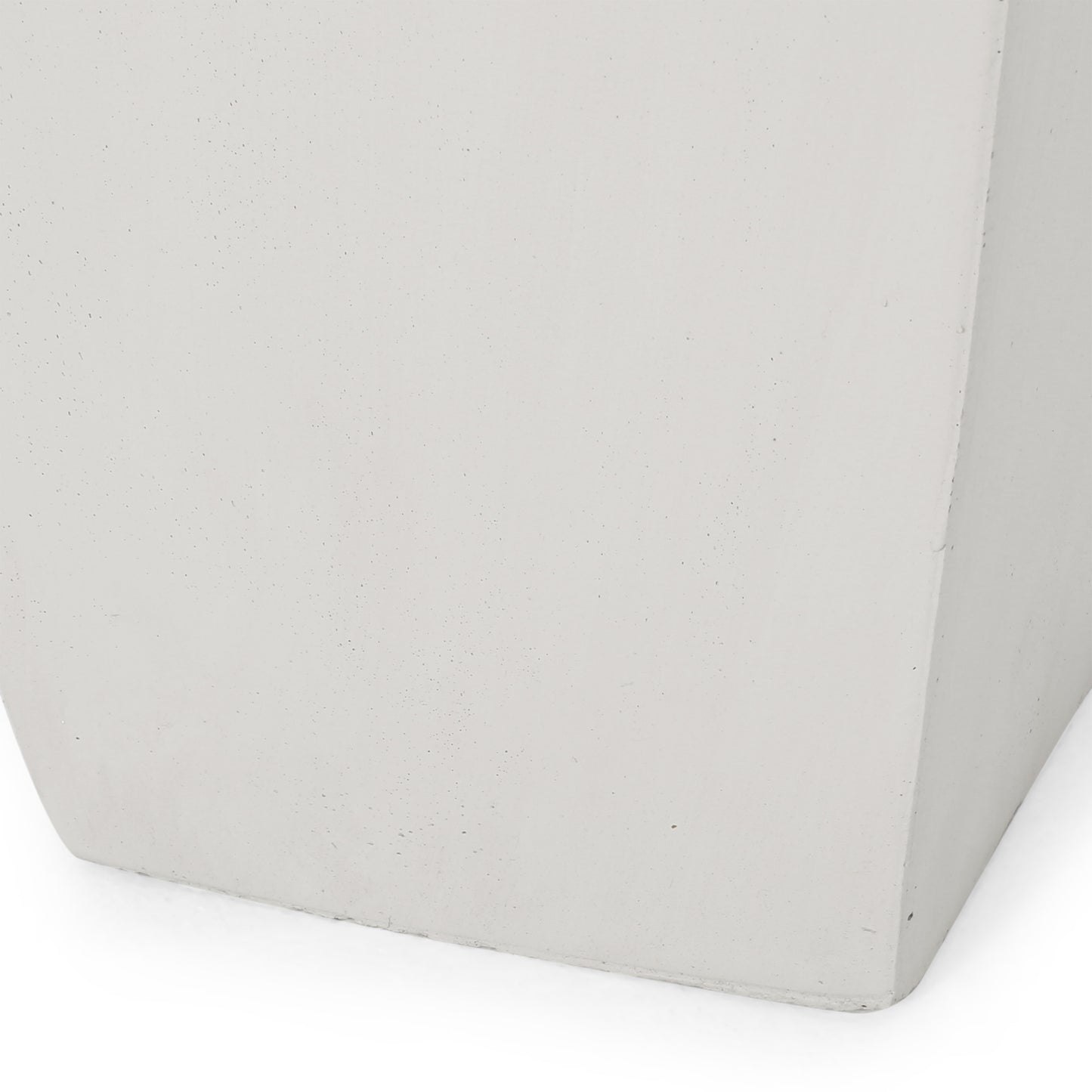 Closeup of a light gray textured concrete planter base
