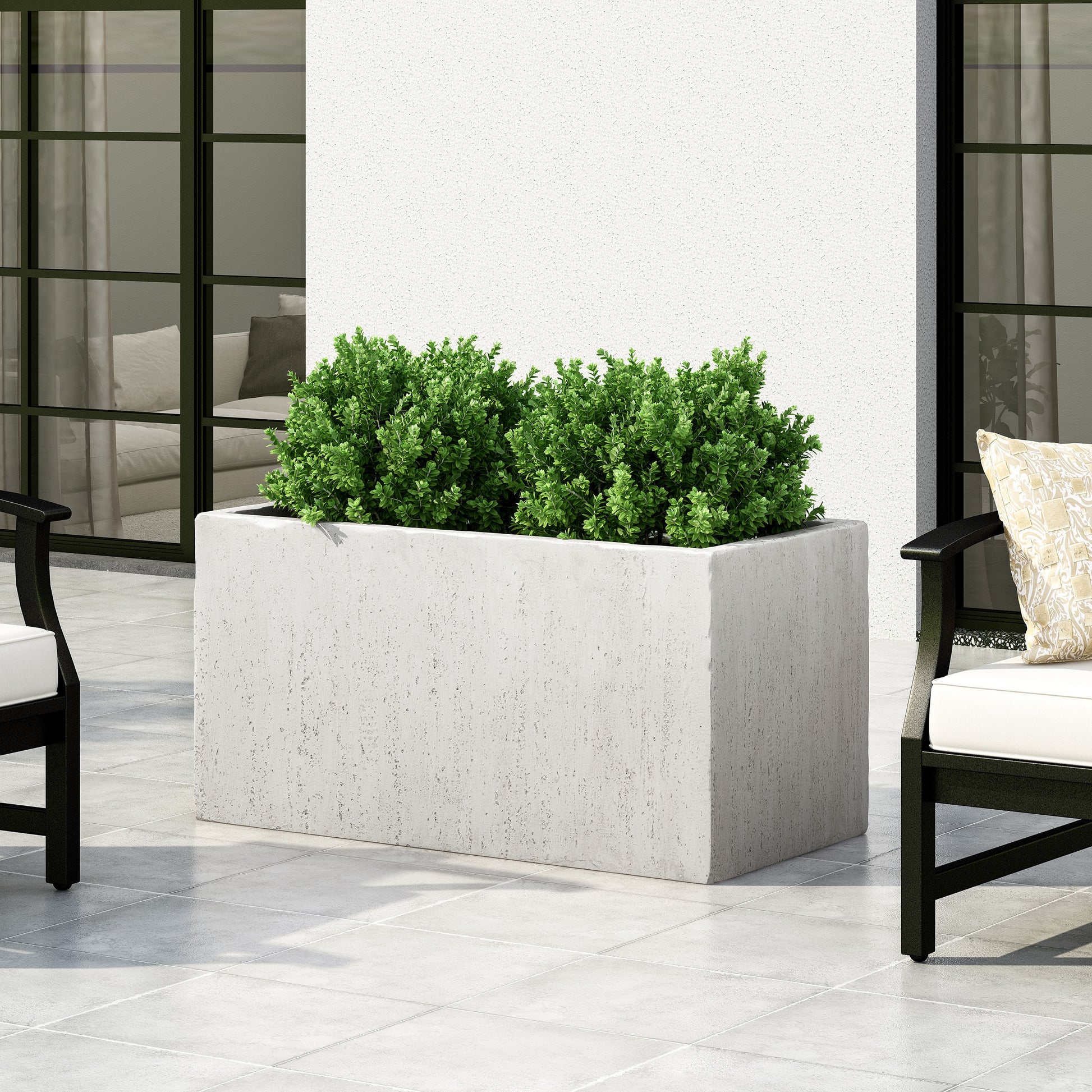Modern rectangular concrete planter with lush green shrubs perfect for patio decor