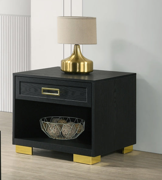 Black wood nightstand with gold hardware and accents featuring a drawer and open shelf