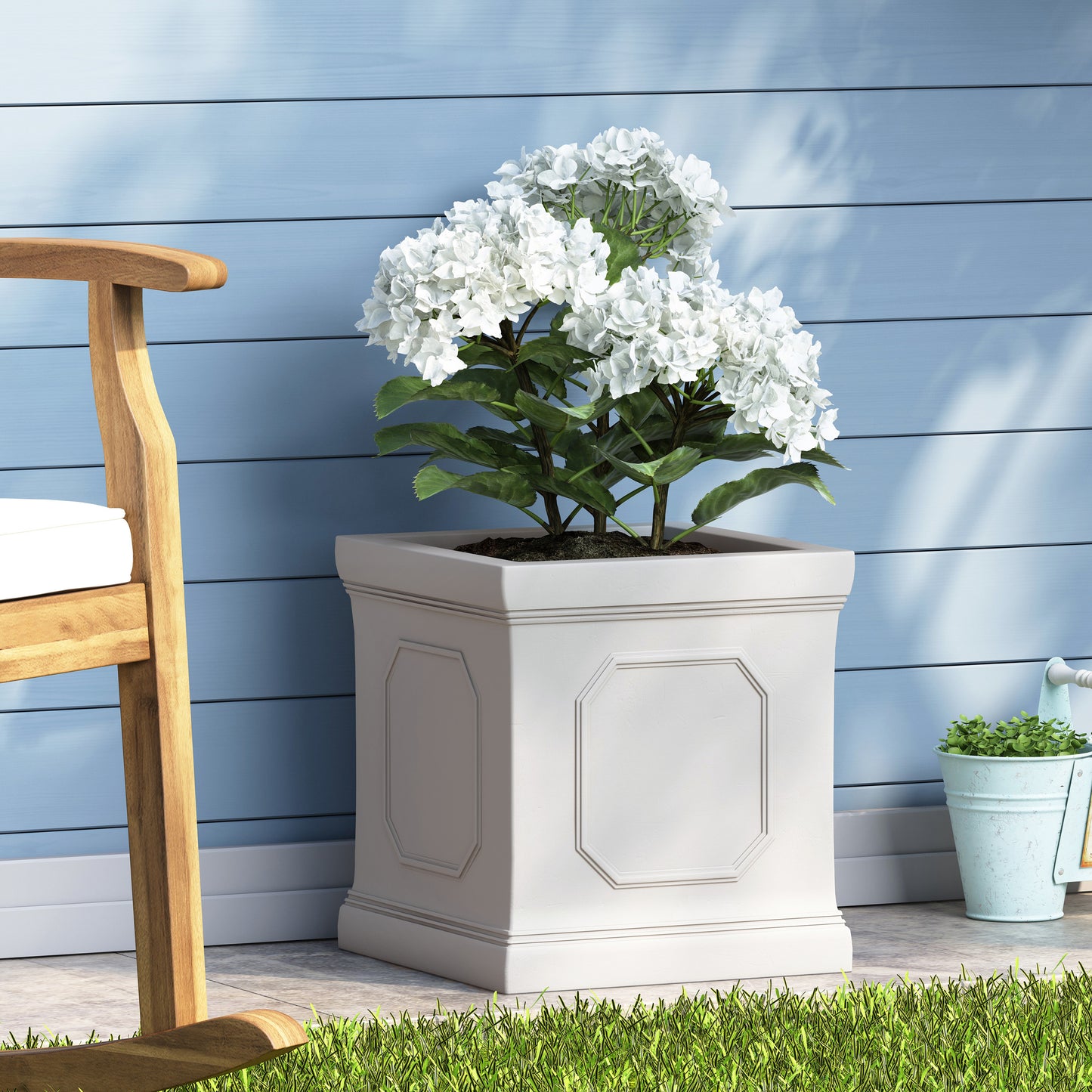 White hydrangeas in a square decorative planter ideal for patio decor