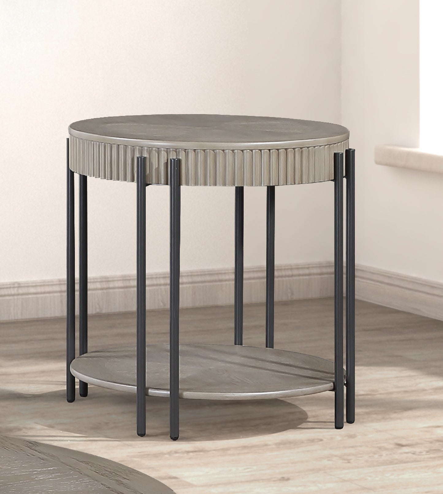 Modern round metal side table with ribbed detail and lower shelf