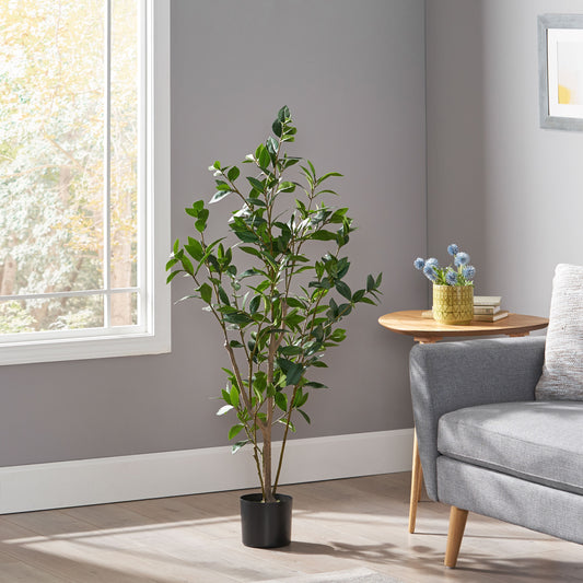 Tall artificial ficus tree with lush green leaves in a black planter ideal for home decor