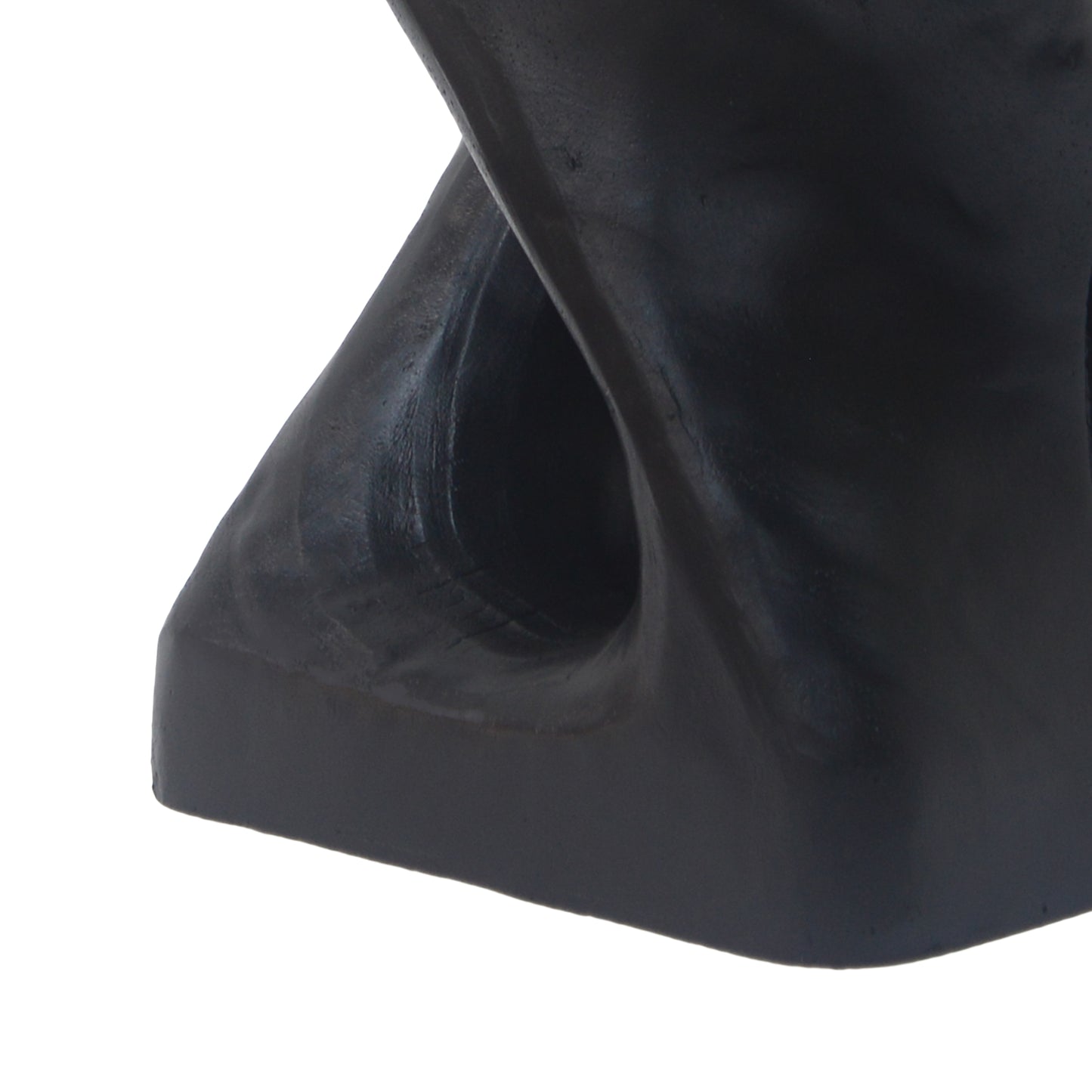 Closeup of a smooth black abstract sculpture with a rounded cutout