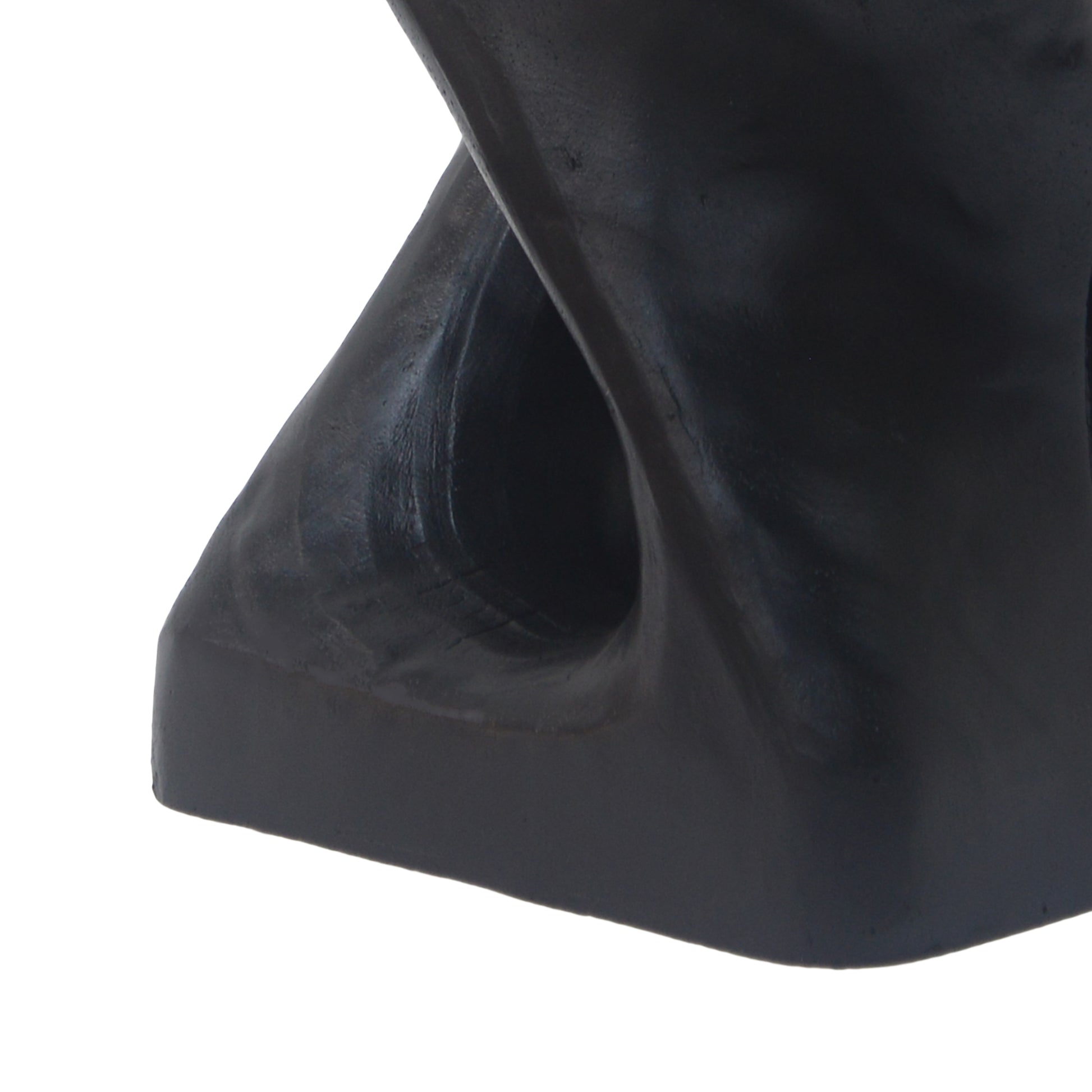 Closeup of a smooth black abstract sculpture with a rounded cutout