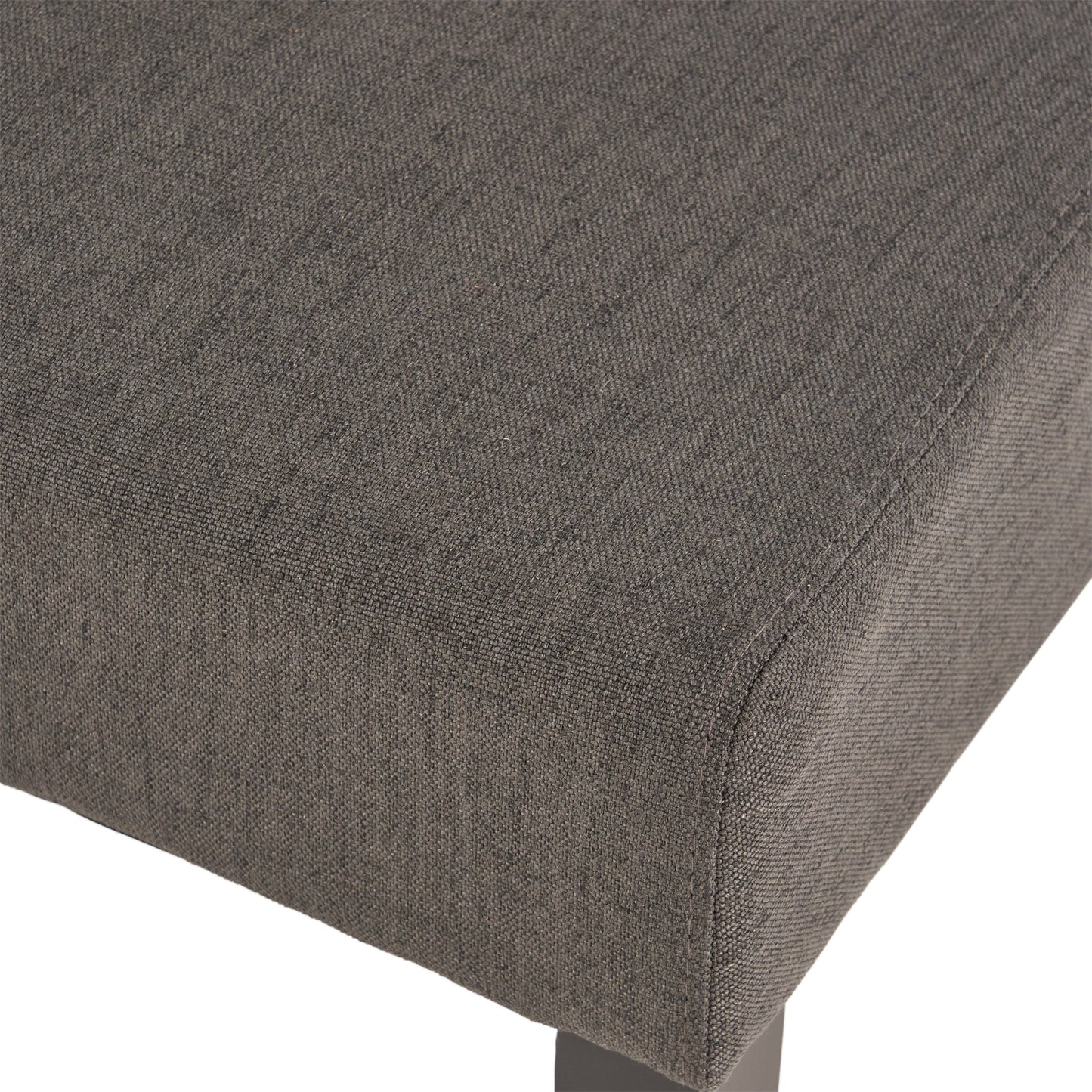Closeup of charcoal grey textured fabric upholstery on a modern chair