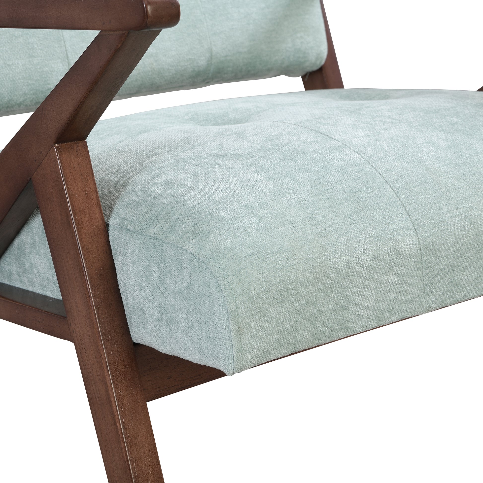 Light blue upholstered armchair with dark wood frame accents a modern accent chair
