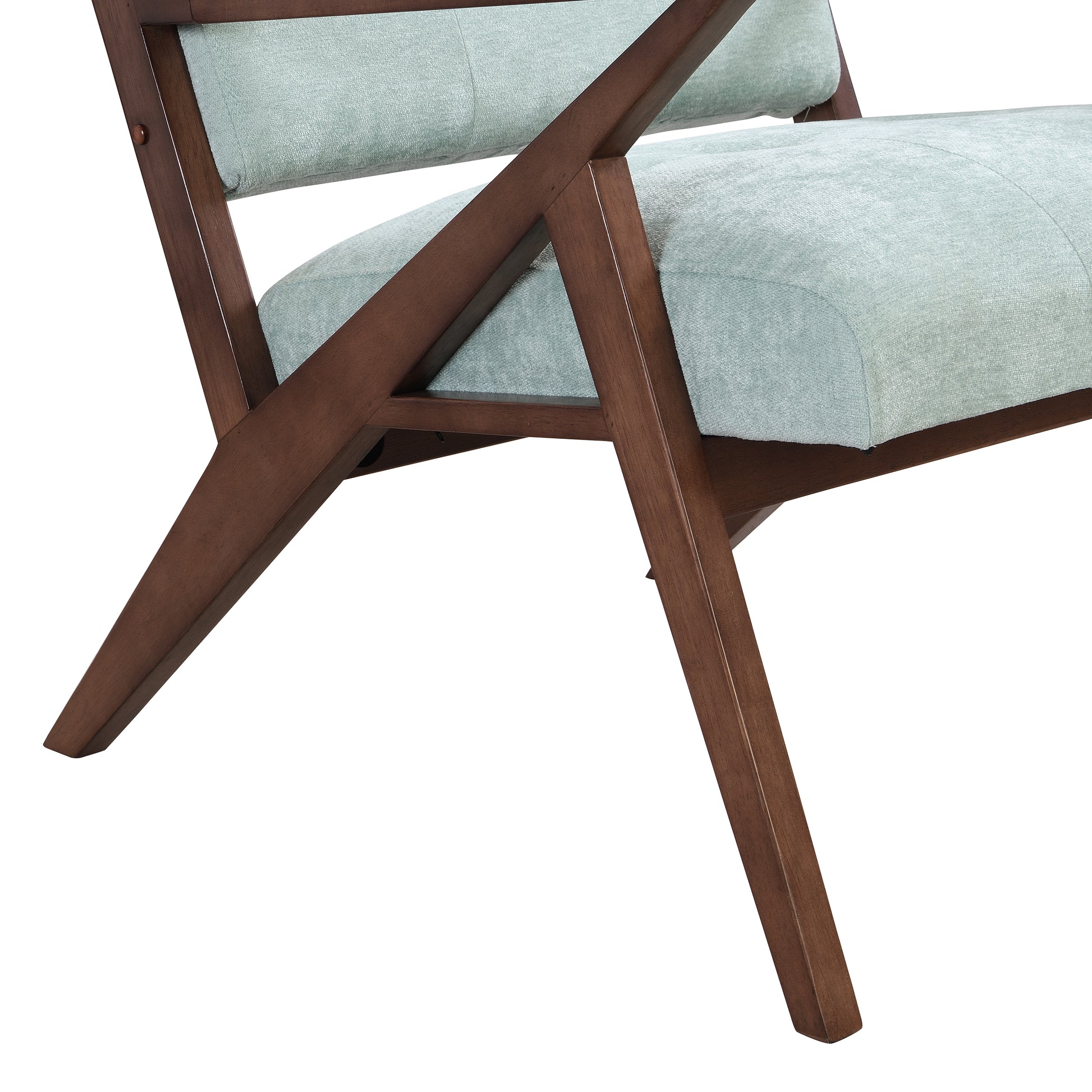 Closeup of a modern armchair with light blue textured fabric and dark wood angled legs