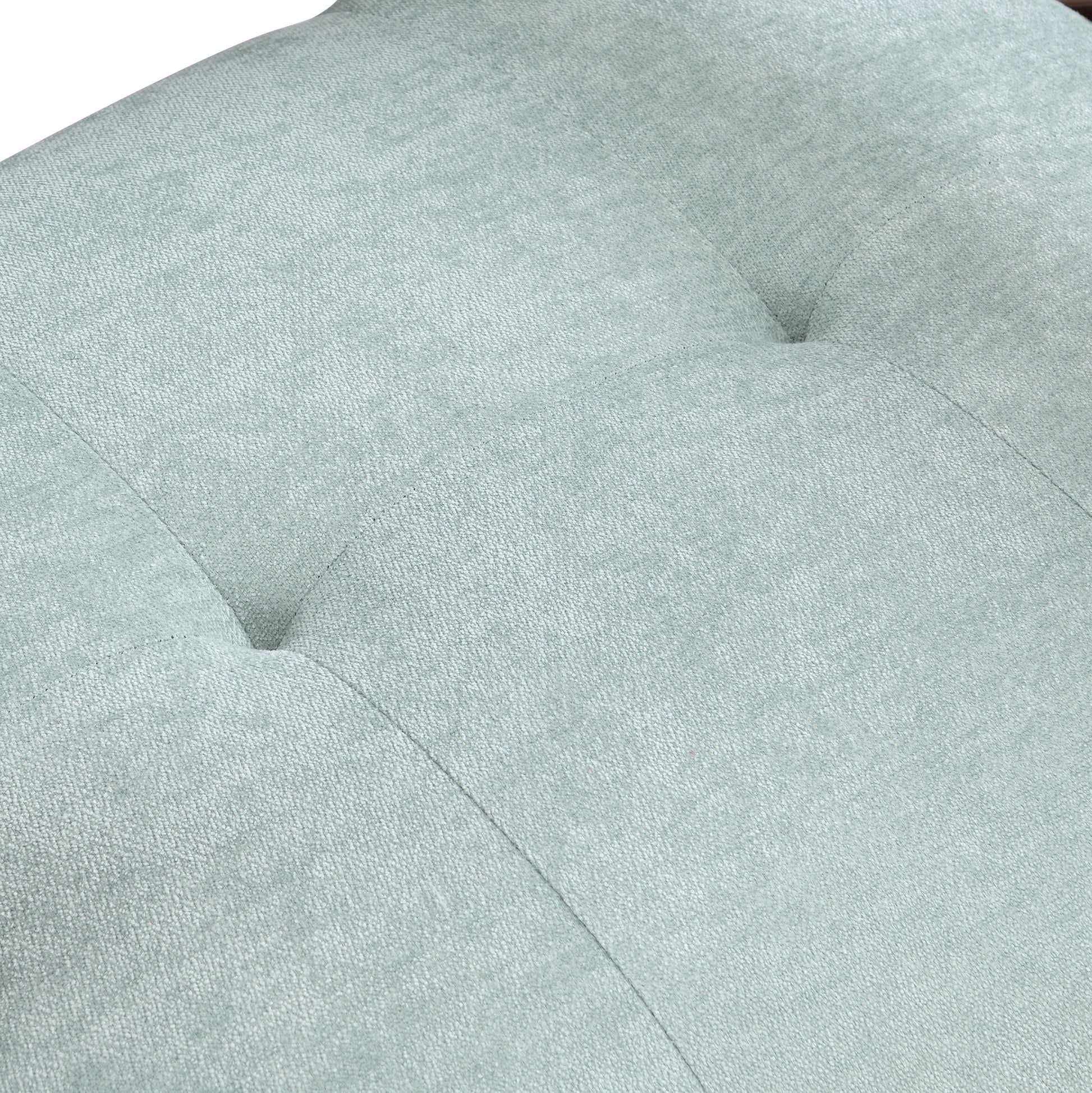 Tufted light blue fabric detail with diamond stitching for modern upholstery