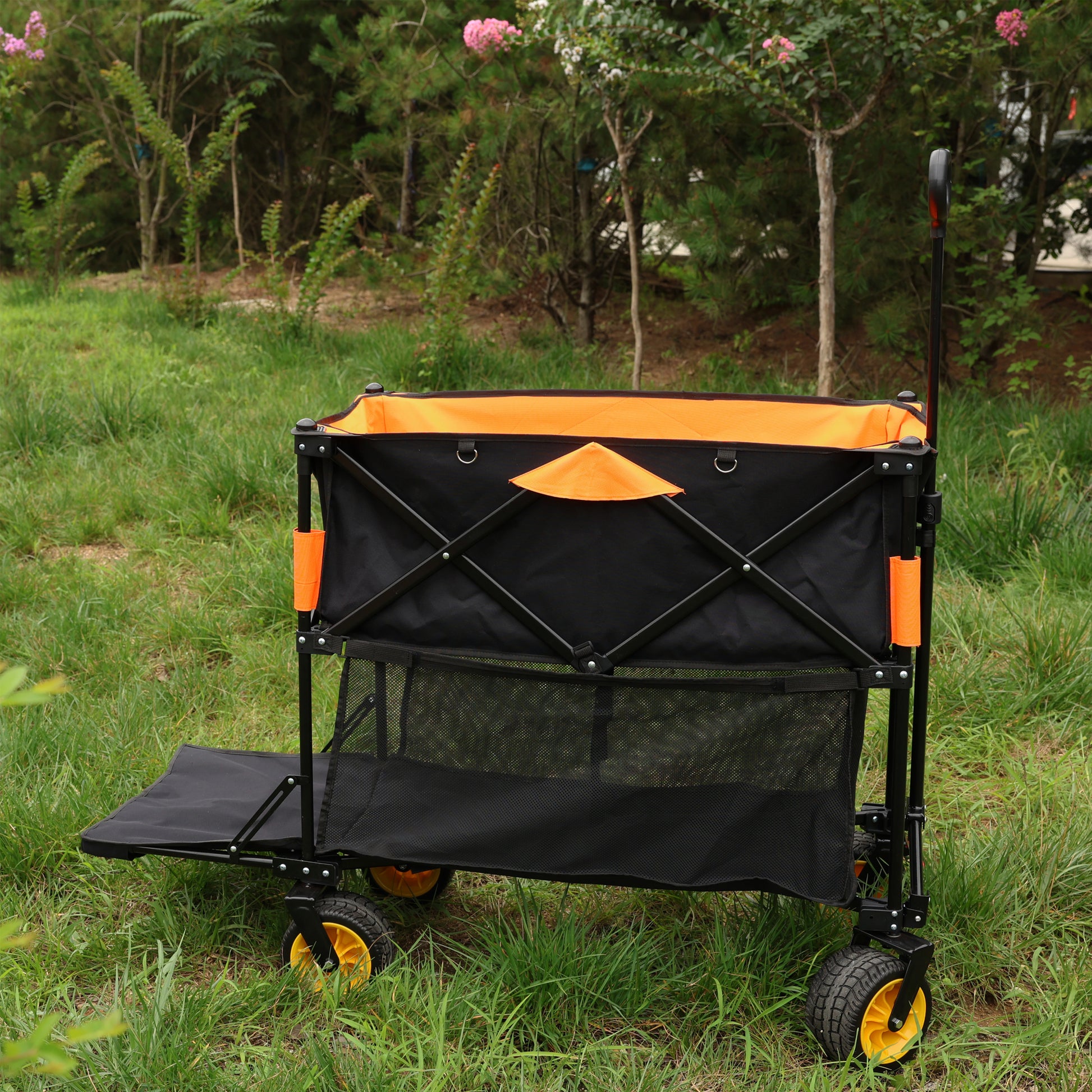 Black and orange collapsible wagon with a mesh storage compartment and yellow wheels