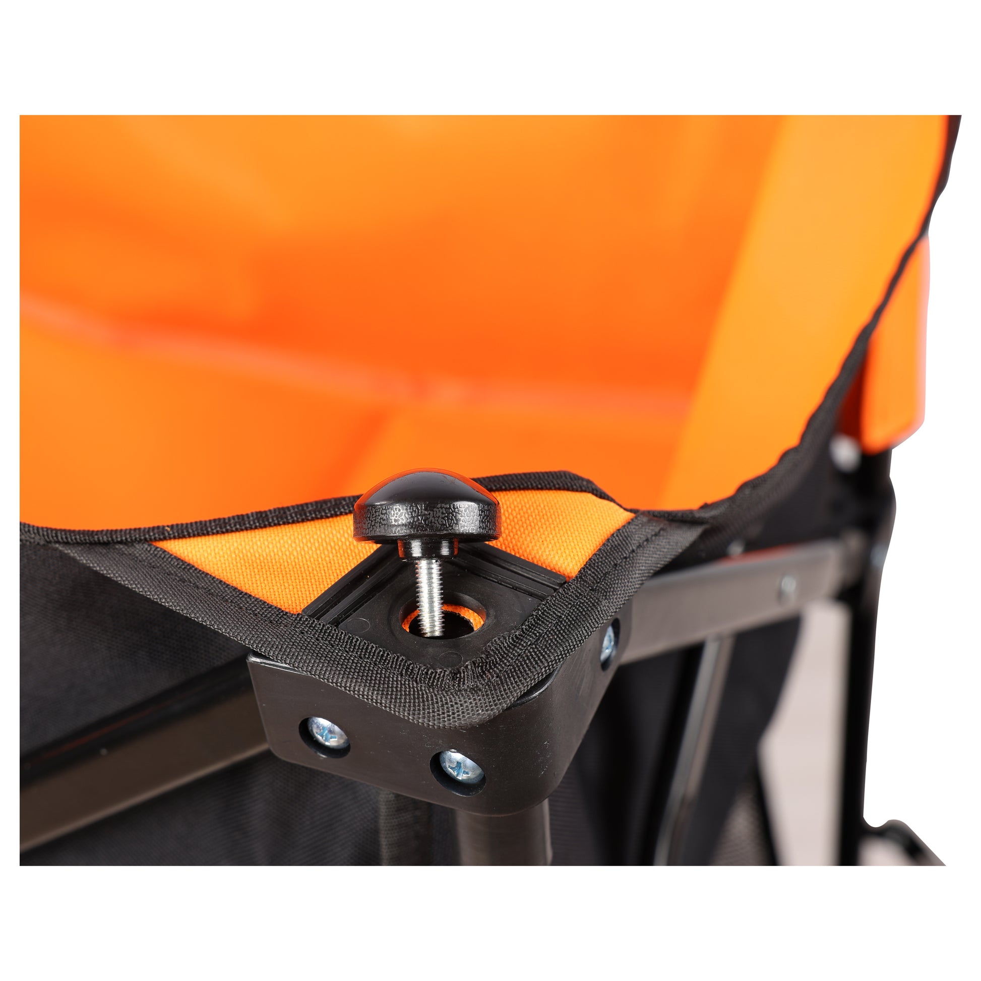 Closeup of a black knob securing the orange fabric of a portable folding chair